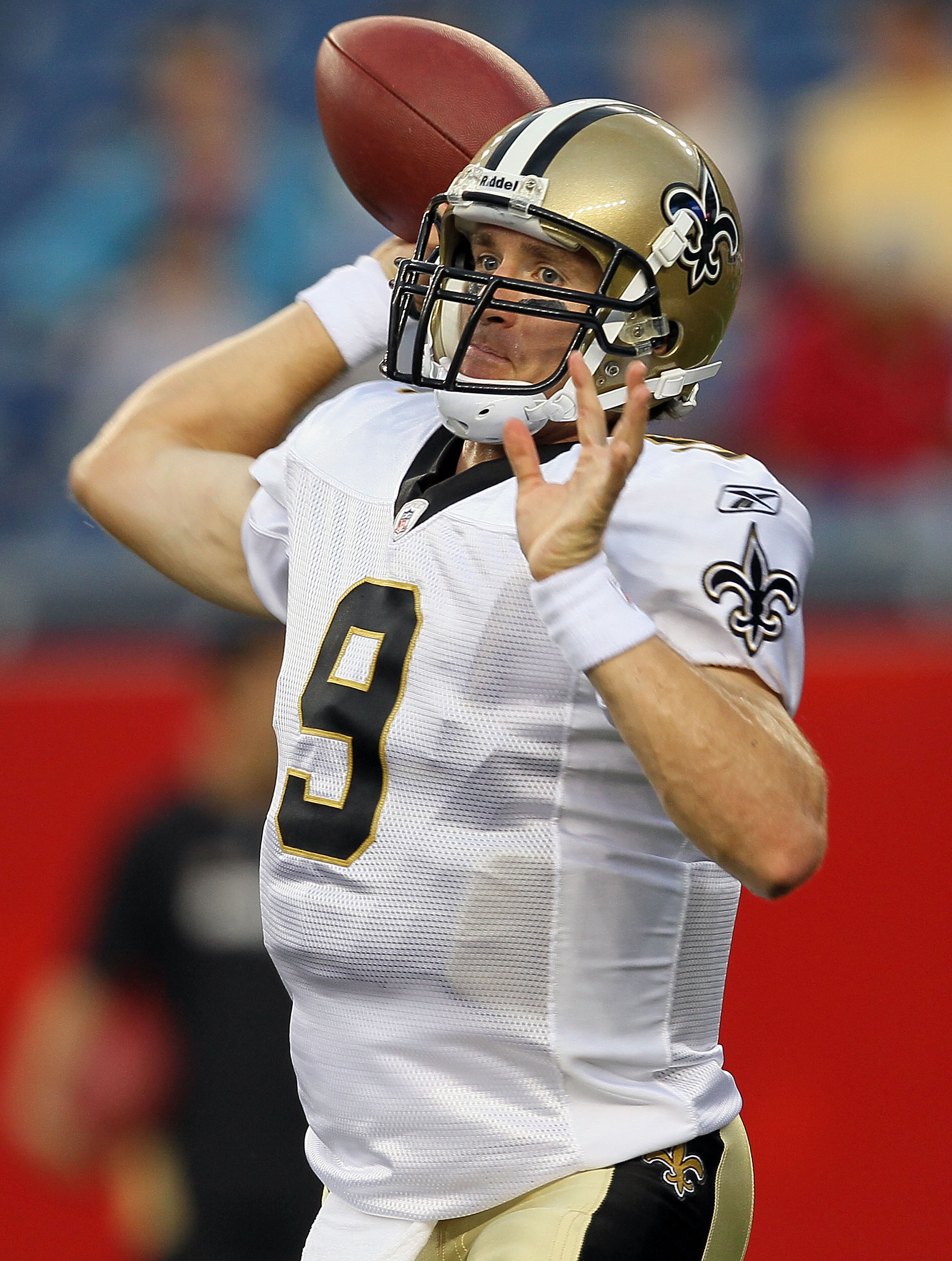 FOXBORO, MA - AUGUST 12: Drew Brees # 9 of the New Orleans Saints throws a pass during pregame of the preseason game against the New England Patriots at Gillette Stadium on August 12, 2010 in Foxboro, Massachusetts. (Photo by Jim Rogash/Getty Images)