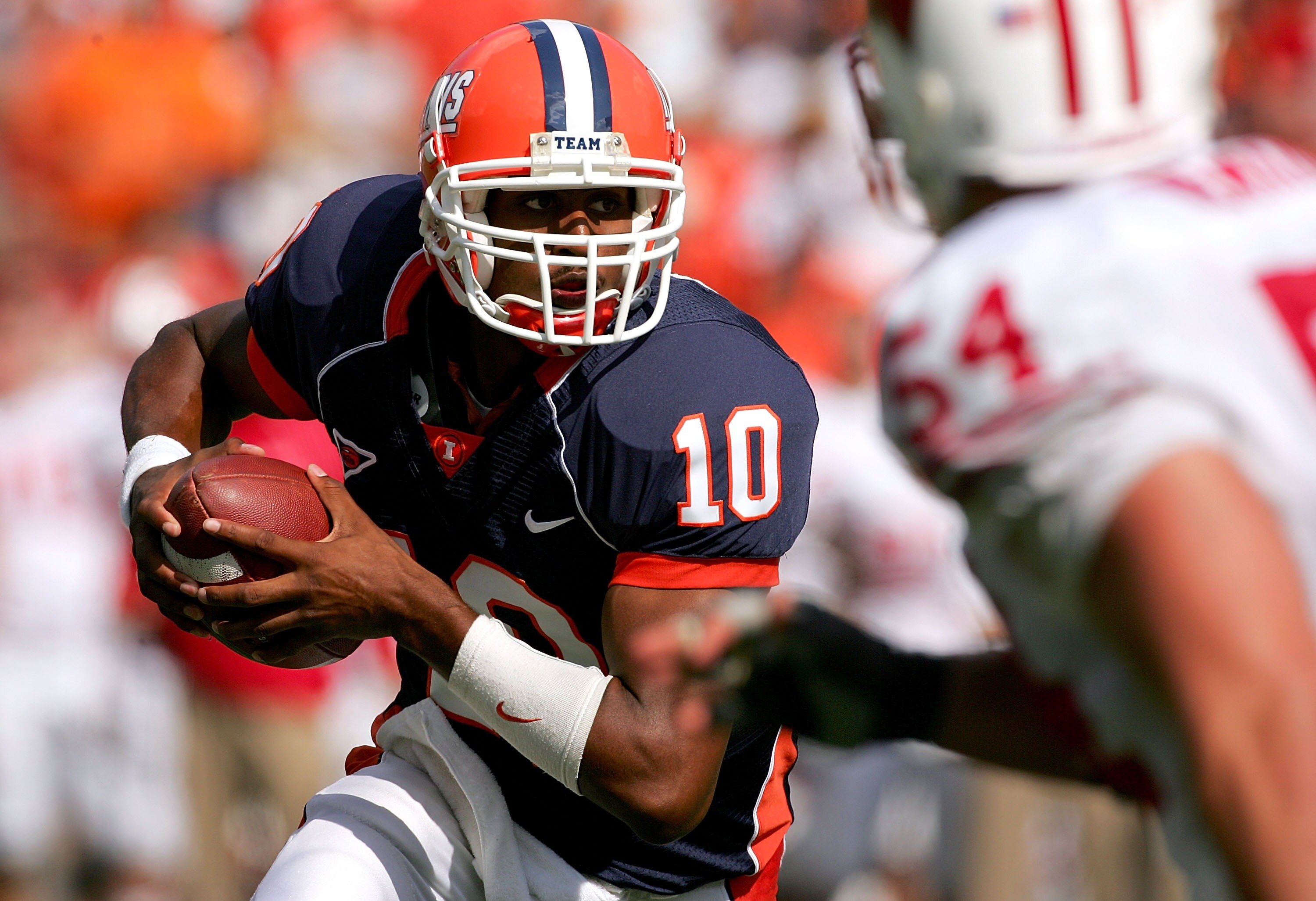 CHAMPAIGN, IL - OCTOBER 06:  Quarterback Eddie McGee #10 of the Illinois Fighting Illini runs out of the pocket against the Wisconsin Badgers October 6, 2007 at Memorial Stadium in Champaign, Illinois.  (Photo by Matthew Stockman/Getty Images)