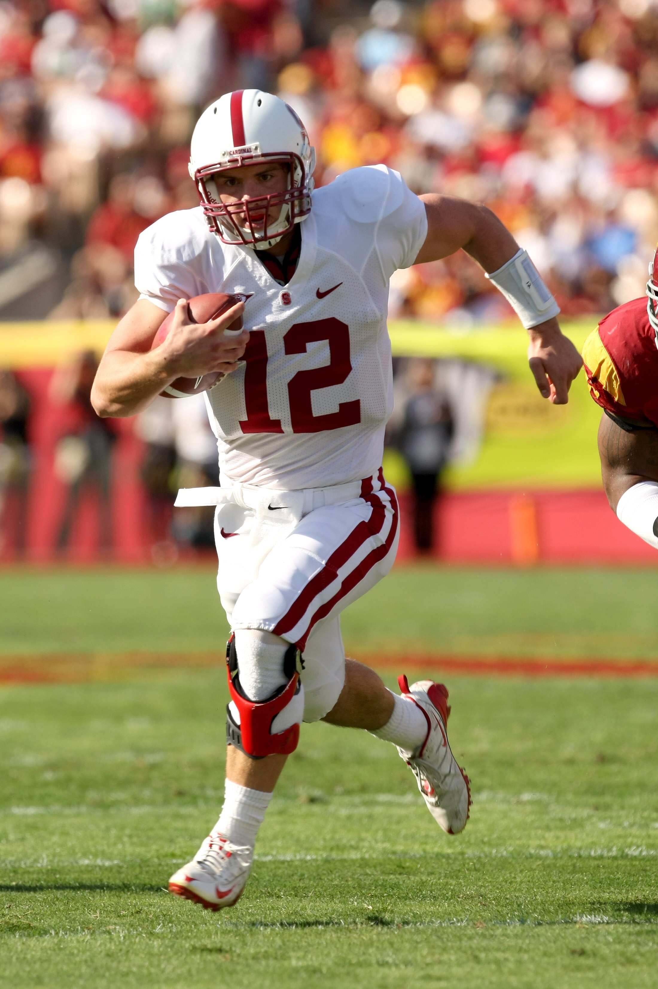 LOS ANGELES, CA - NOVEMBER 14:  Quarterback Andrew Luck #12 of the Stanford Cardinal carries the ball against the USC Trojans on November 14, 2009 at the Los Angeles Coliseum in Los Angeles, California.  Stanford won 55-21.  (Photo by Stephen Dunn/Getty I