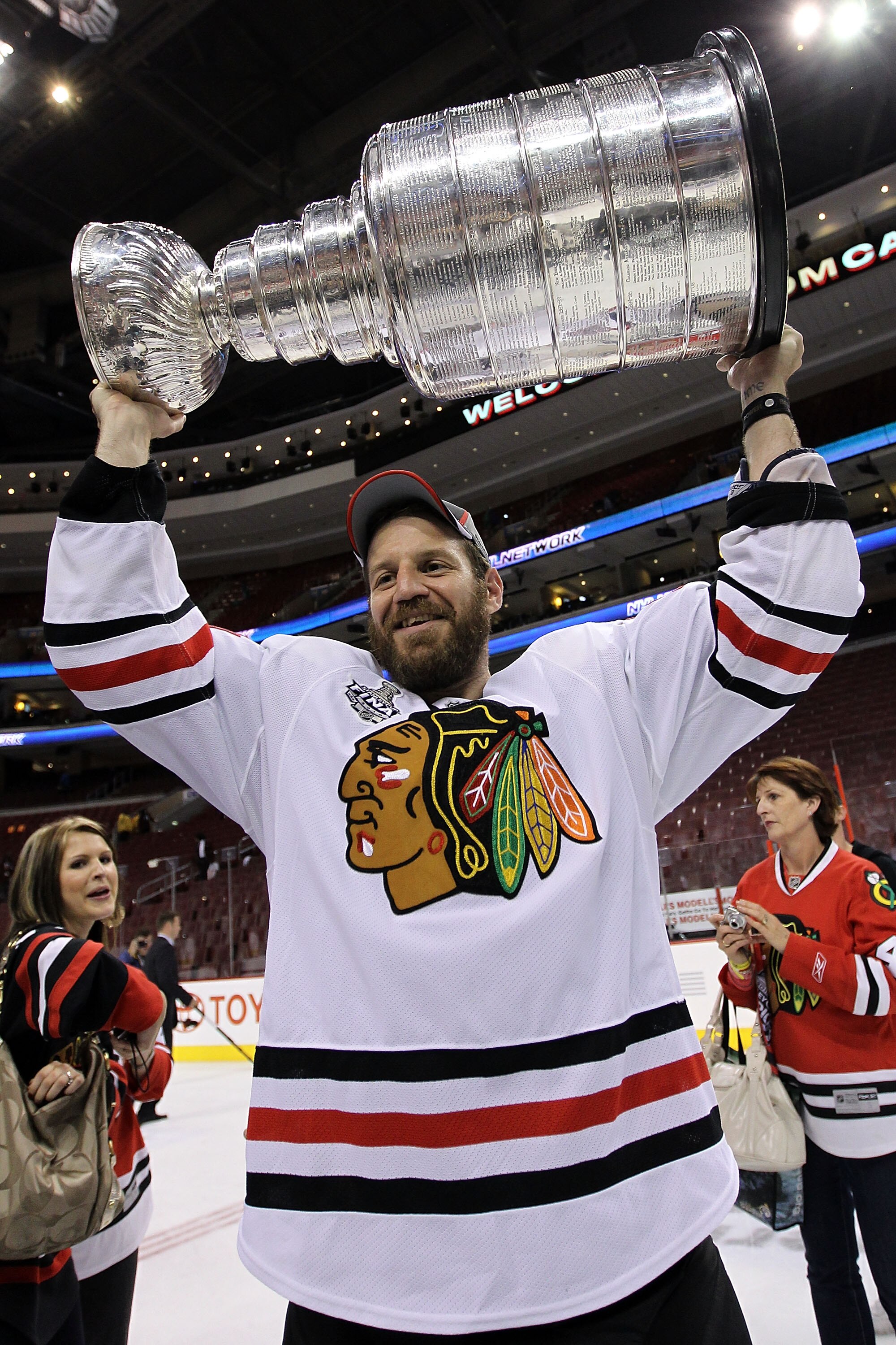 PHILADELPHIA - JUNE 09:  Nick Boynton #24 hoists the Stanley Cup after teammate Patrick Kane #88 scored the game-winning goal in overtime to defeat the Philadelphia Flyers 4-3 and win the Stanley Cup in Game Six of the 2010 NHL Stanley Cup Final at the Wa