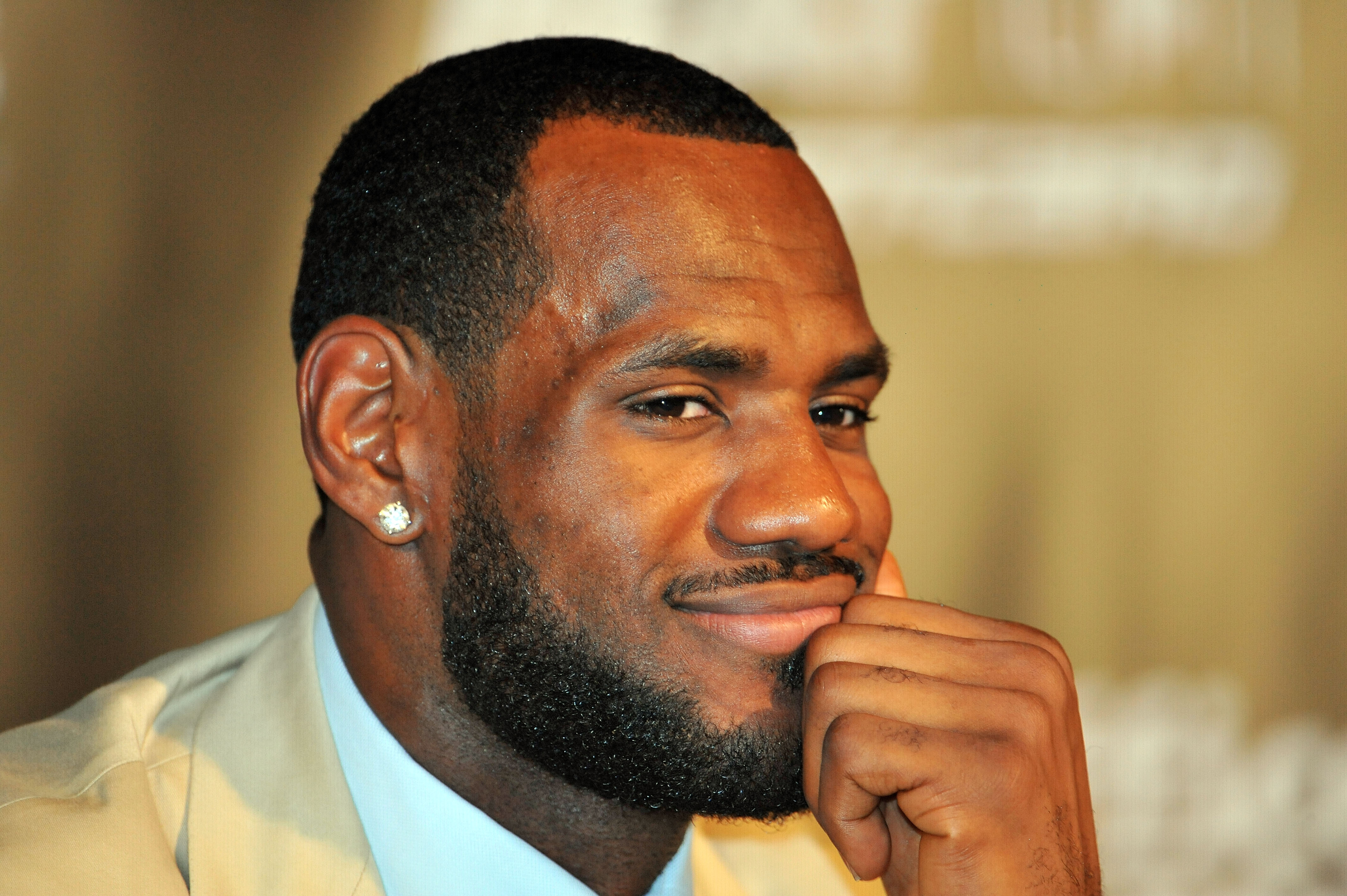 MIAMI - JULY 09:  LeBron James #6, of the Miami Heat smiles during a press conference after a welcome party at American Airlines Arena on July 9, 2010 in Miami, Florida.  (Photo by Doug Benc/Getty Images)