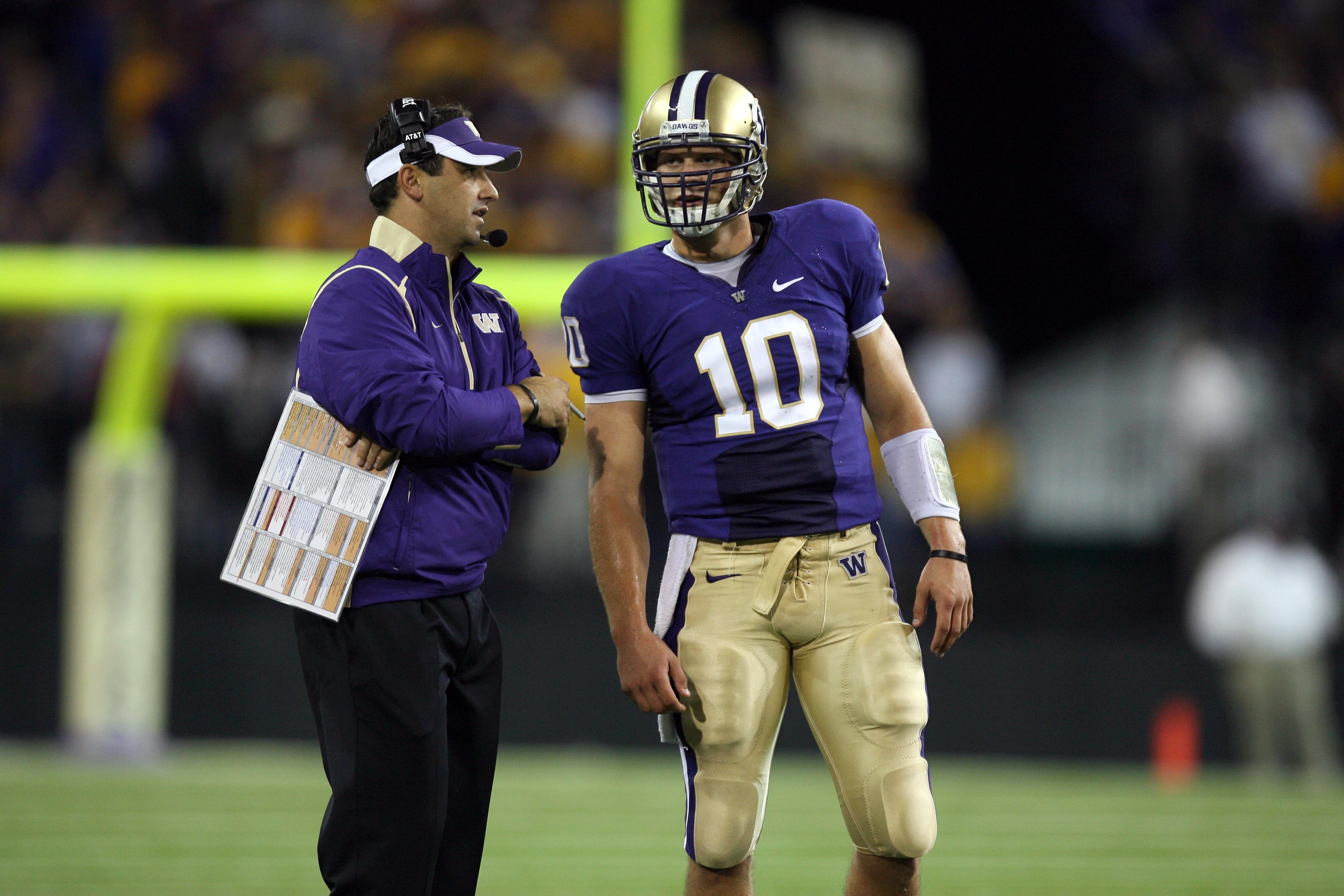 SEATTLE - SEPTEMBER 5:  Head Coach Steve Sarkisian of the Washington Huskies speaks to quarterback Jake Locker #10 of the Washington Huskies during their game against the LSU Tigers on September 5, 2009 at Husky Stadium in Seattle, Washington. The LSU Tig