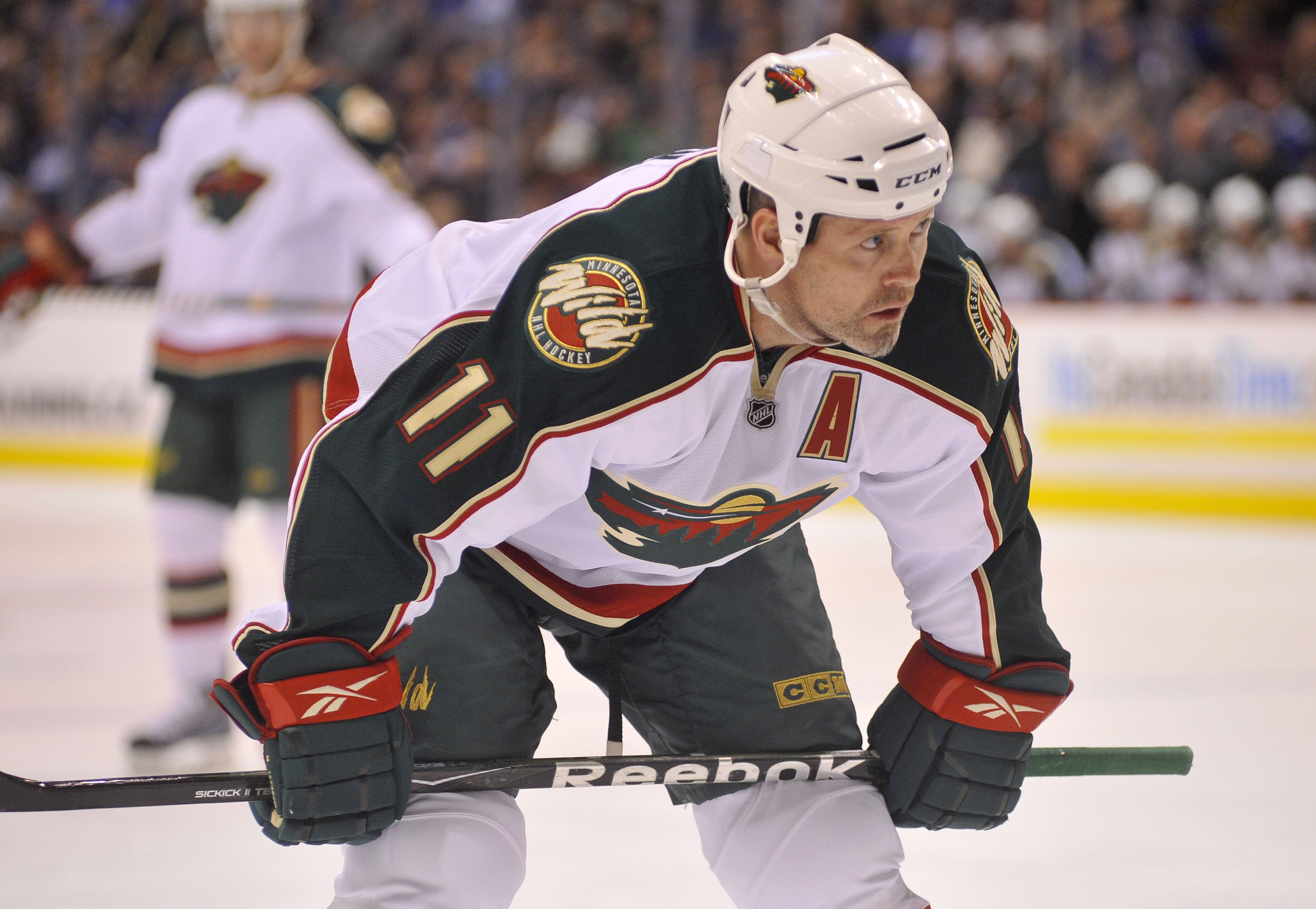 VANCOUVER, CANADA - APRIL 4: Owen Nolan #11 of the Minnesota Wild gets ready for a face-off during the NHL game against the Vancouver Canucks on April 04, 2010 at General Motors Place in Vancouver, British Columbia, Canada.  (Photo by Rich Lam/Getty Image