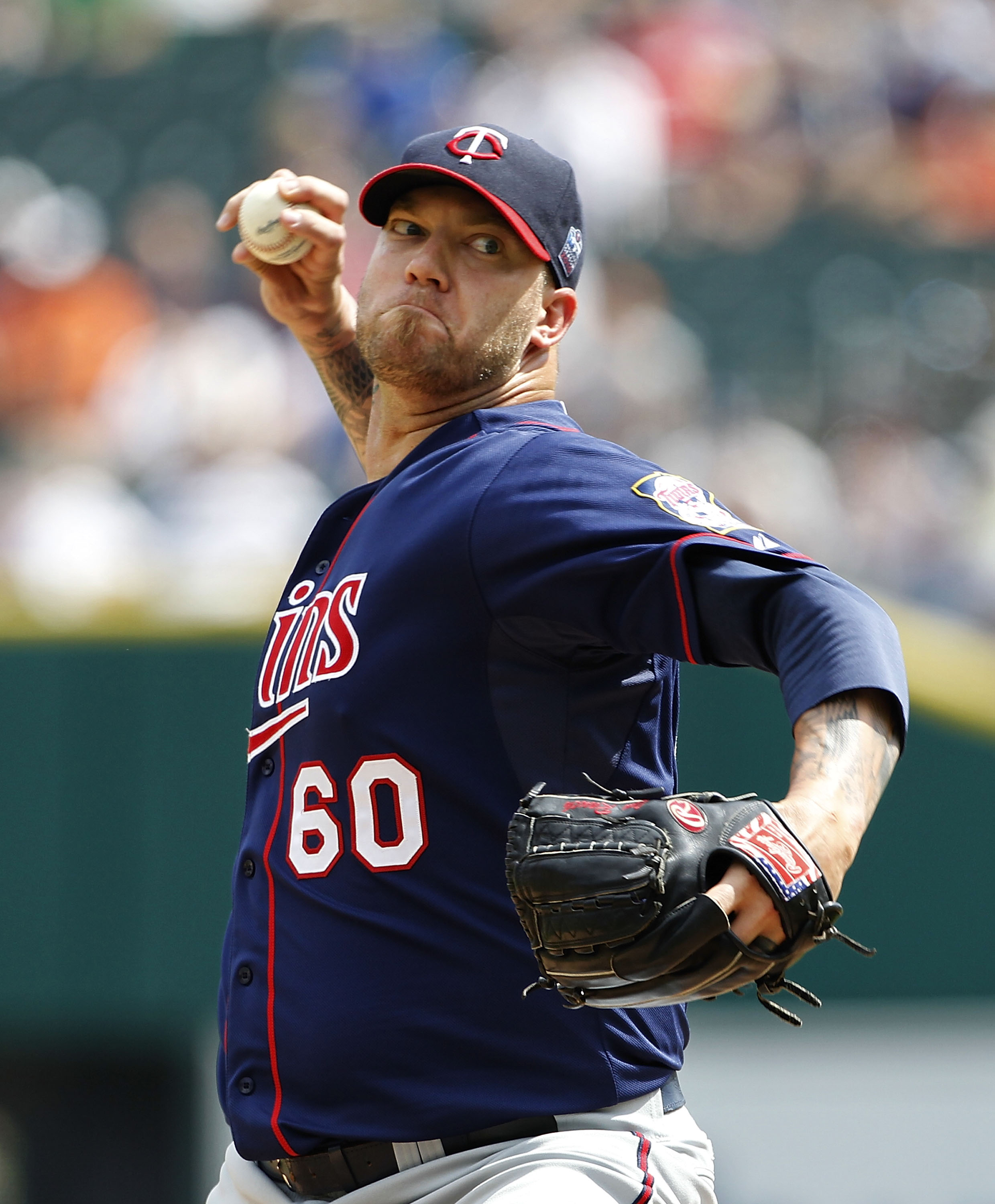 DETROIT - JULY 11: Jon Rauch #60 of the Minnesota Twins pitches in the ninth inning during the game against the Detroit Tigers on July 11, 2010 at Comerica Park in Detroit, Michigan. The Twins defeated the Tigers 6-3.  (Photo by Leon Halip/Getty Images)