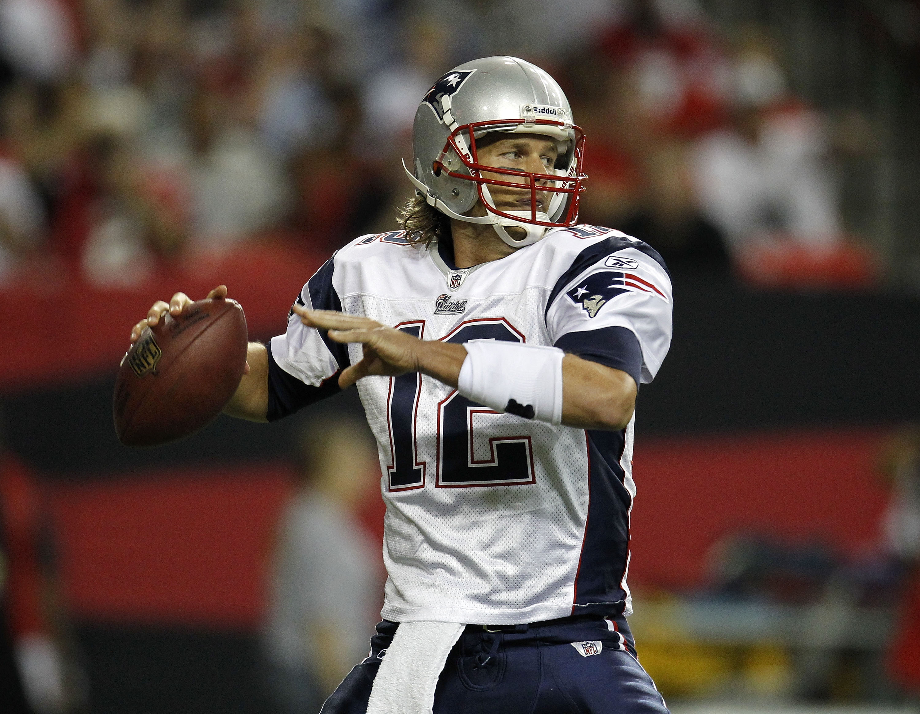ATLANTA - AUGUST 19:  Quarterback Tom Brady #12 of the New England Patriots drops back to pass during the preseason game against the Atlanta Falcons at the Georgia Dome on August 19, 2010 in Atlanta, Georgia.  The Patriots beat the Falcons 28-10.  (Photo