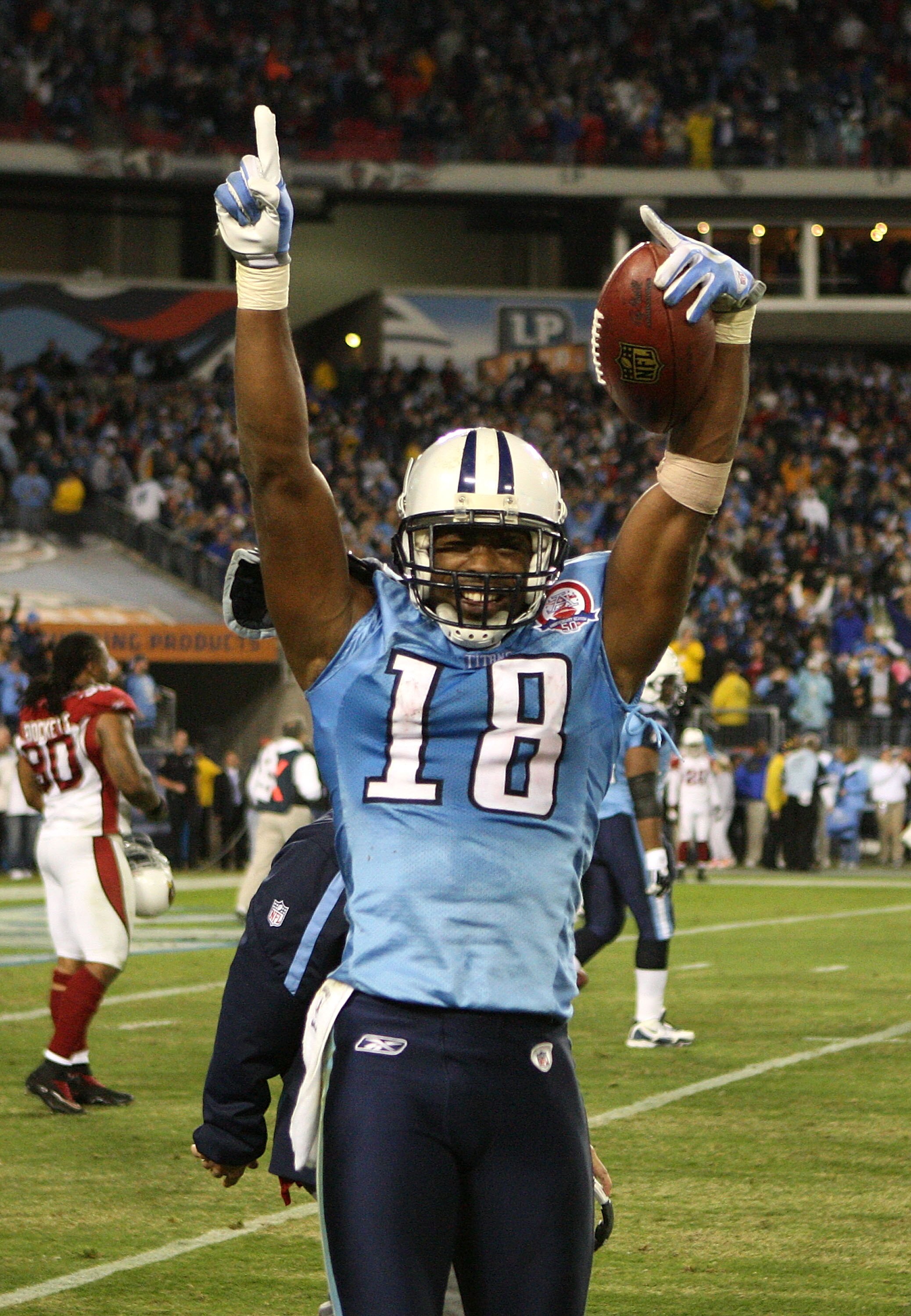 NASHVILLE, TN - NOVEMBER 29:  Kenny Britt #18 of the Tennessee Titans celebrates after catching the game-winning touchdown to give the Titans a 20-17 victory over the Arizona Cardinals during their game at LP Field on November 29, 2009 in Nashville, Tenne