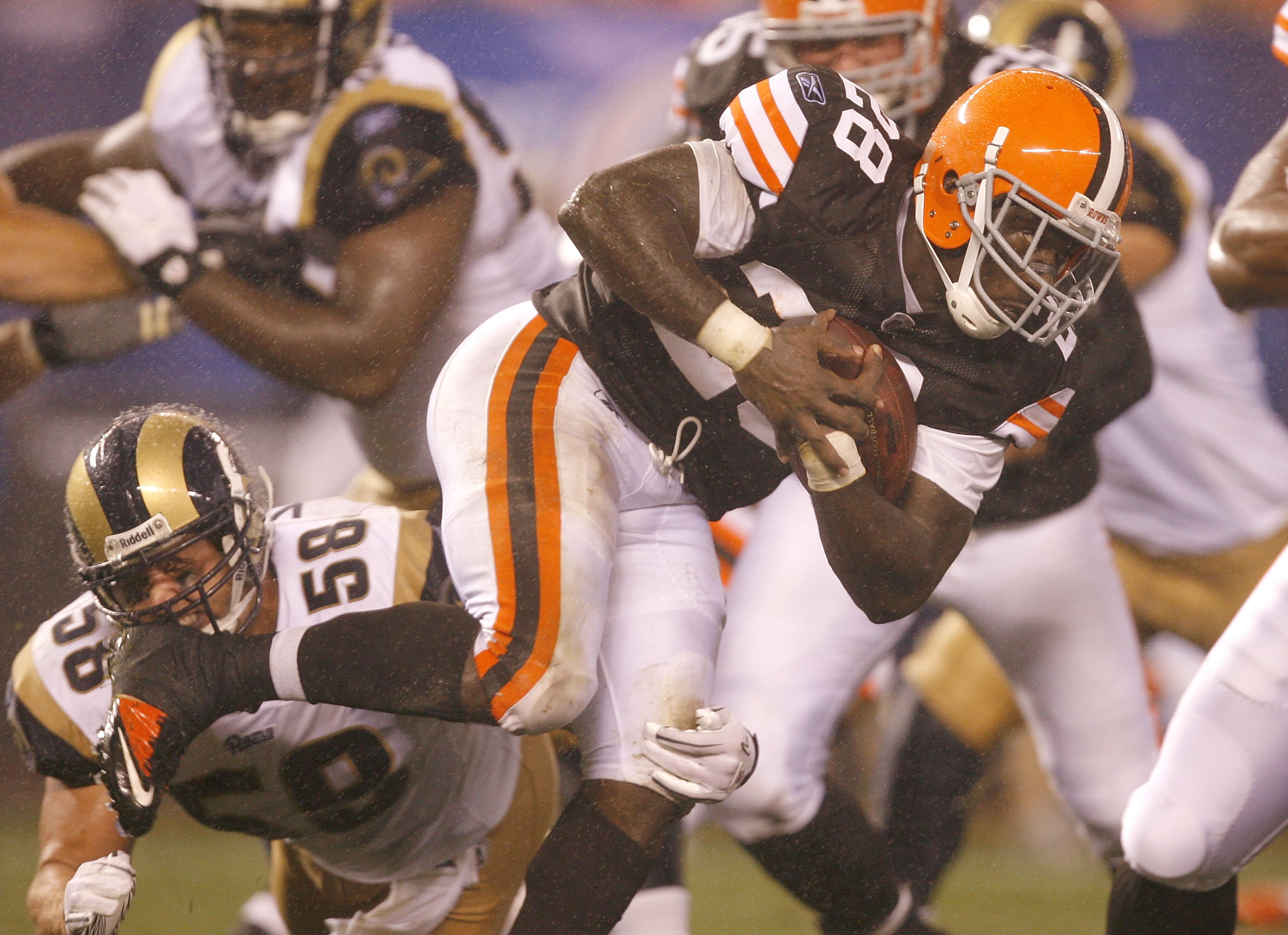 CLEVELAND - AUGUST 21:  James Davis #28 of the Cleveland Browns runs by David Vobora #58 of the St. Louis Rams at Cleveland Browns Stadium on August 21, 2010 in Cleveland, Ohio.  (Photo by Matt Sullivan/Getty Images)