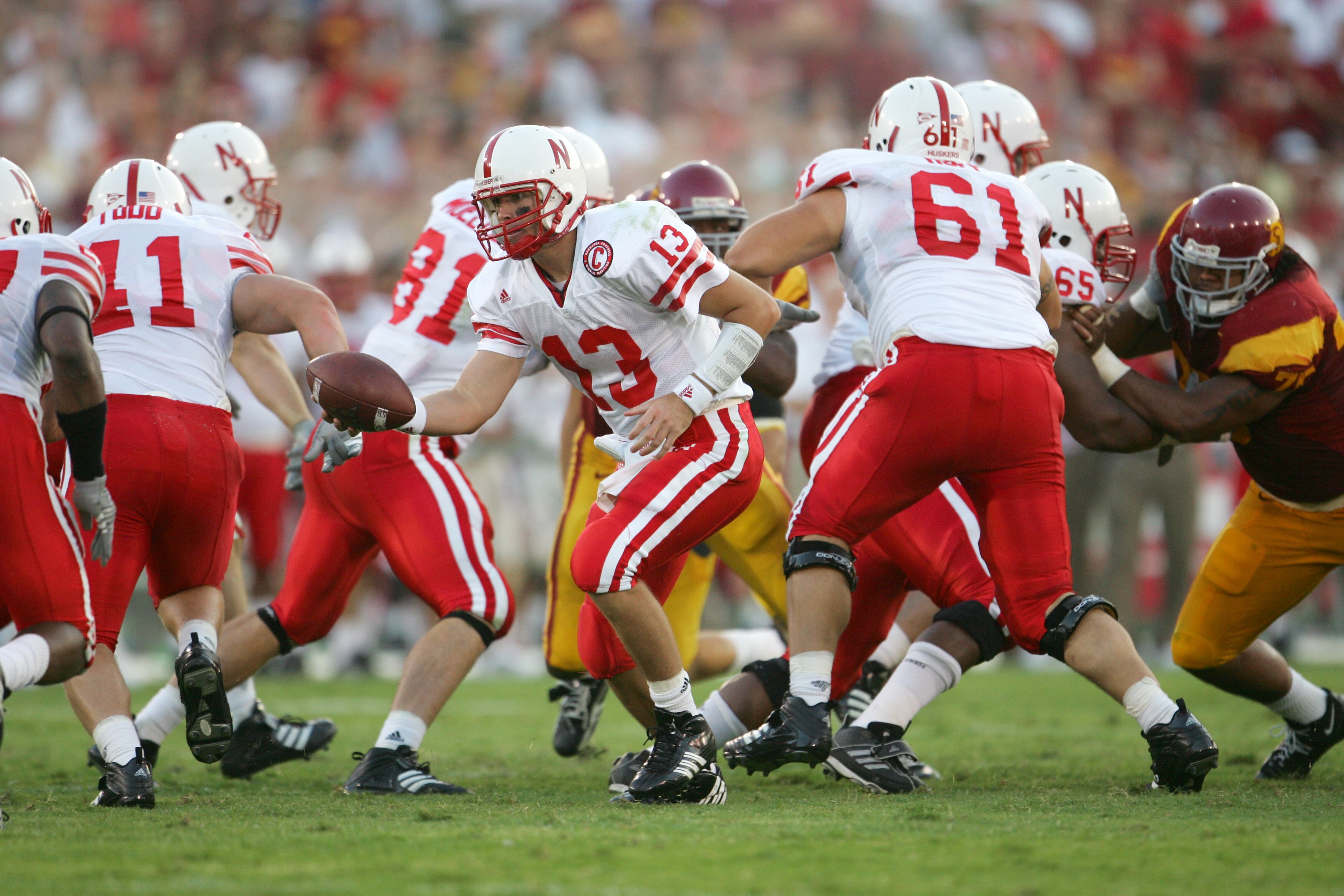 LOS ANGELES - SEPTEMBER 16:  Quarterback Zac Taylor #13 of the University of Nebraska Cornhuskers attempts to hand-off the ball against the University of Southern California Trojans during the game at the Los Angeles Memorial Coliseum on September 16, 200