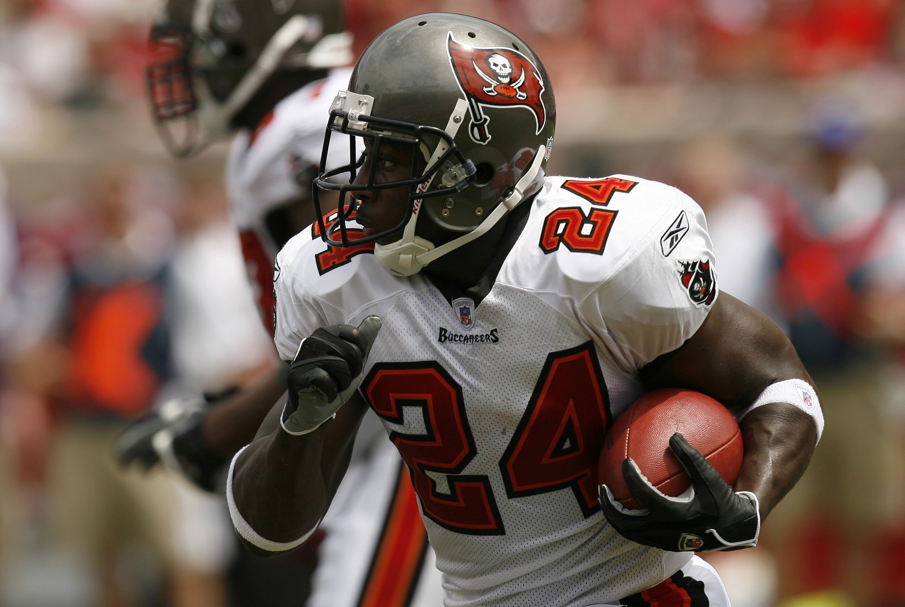 TAMPA, FL - SEPTEMBER 10:  Running back Carnell Williams #24 of the Tampa Bay Buccaneers rushes against the Baltimore Ravens on September 10, 2006 at Raymond James Stadium in Tampa, Florida. The Ravens won 27-0.  (Photo by Matt Stroshane/Getty Images)