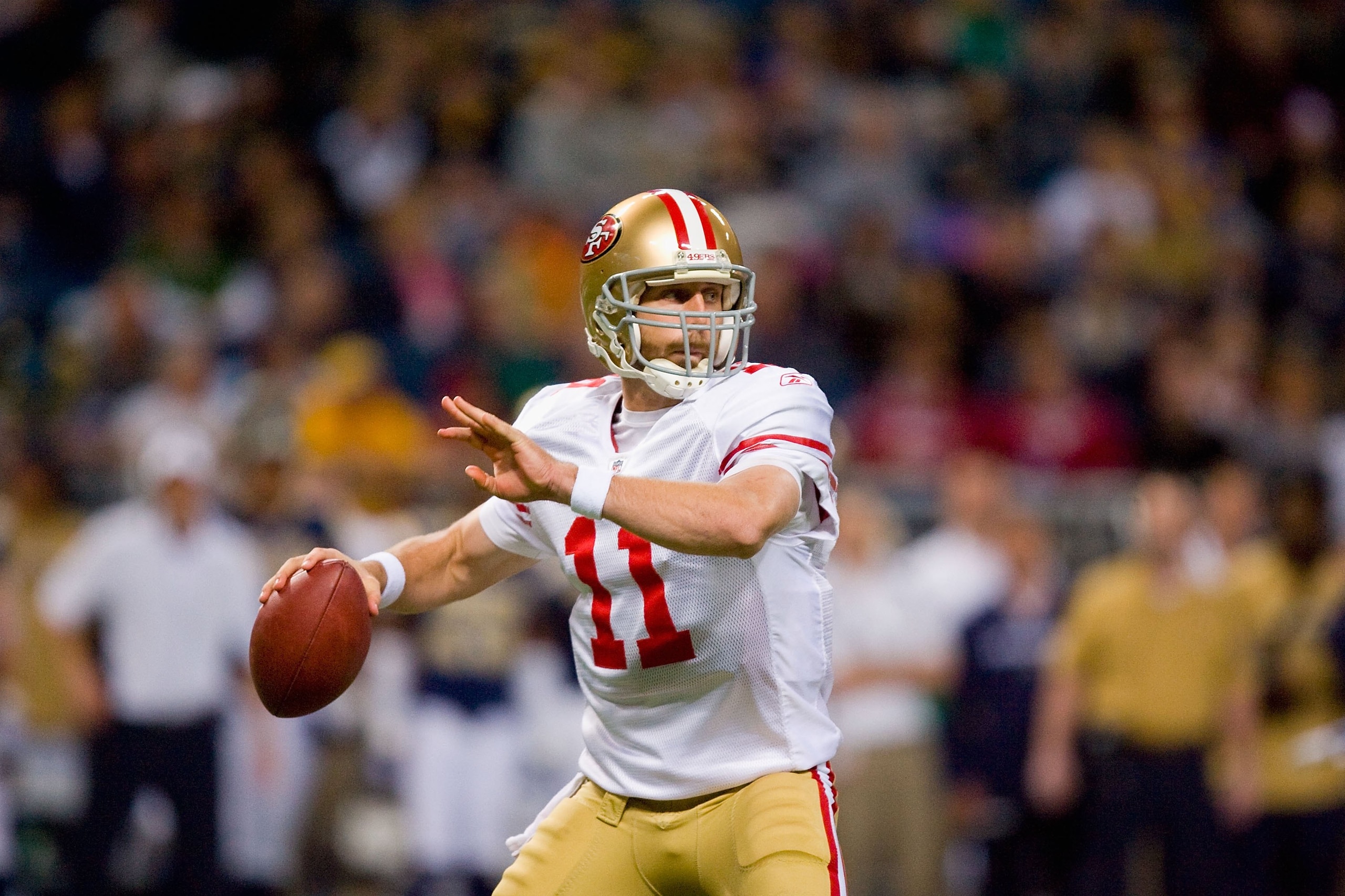 ST. LOUIS - JANUARY 3: Quarterback Alex Smith #11 of the San Francisco 49ers looks to pass the ball during the game against the St. Louis Rams at the Edward Jones Dome on January 3, 2010 in St. Louis, Missouri.  The 49ers beat the Rams 28-6.  (Photo by Di