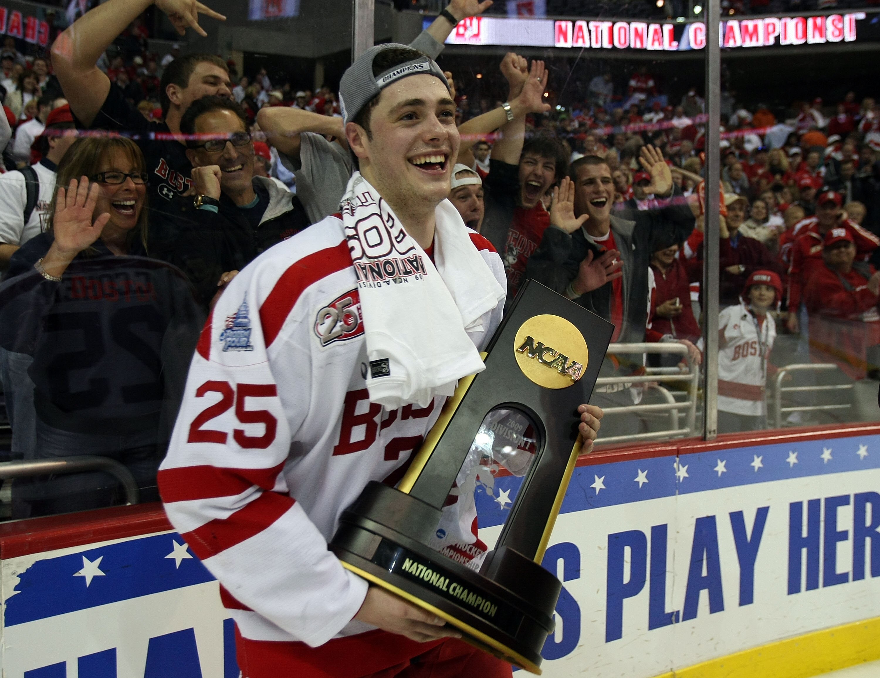 WASHINGTON - APRIL 11:  Colby Cohen #25 of the Boston Terriers celebrates with the championship trophy after defeating the Miami Red Hawks during the NCAA Men's Frozen Four Championship game on April 11, 2009 at the Verizon Center in Washington, DC. Bosto