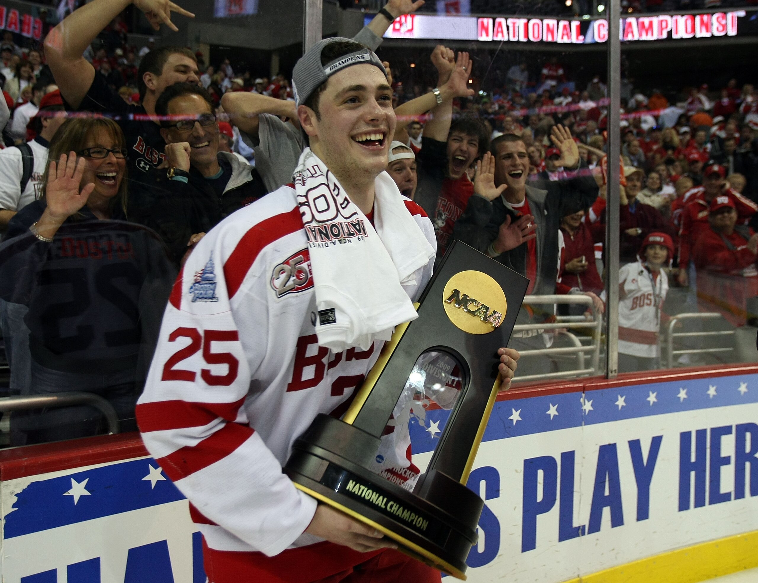 WASHINGTON - APRIL 11:  Colby Cohen #25 of the Boston Terriers celebrates with the championship trophy after defeating the Miami Red Hawks during the NCAA Men's Frozen Four Championship game on April 11, 2009 at the Verizon Center in Washington, DC. Bosto