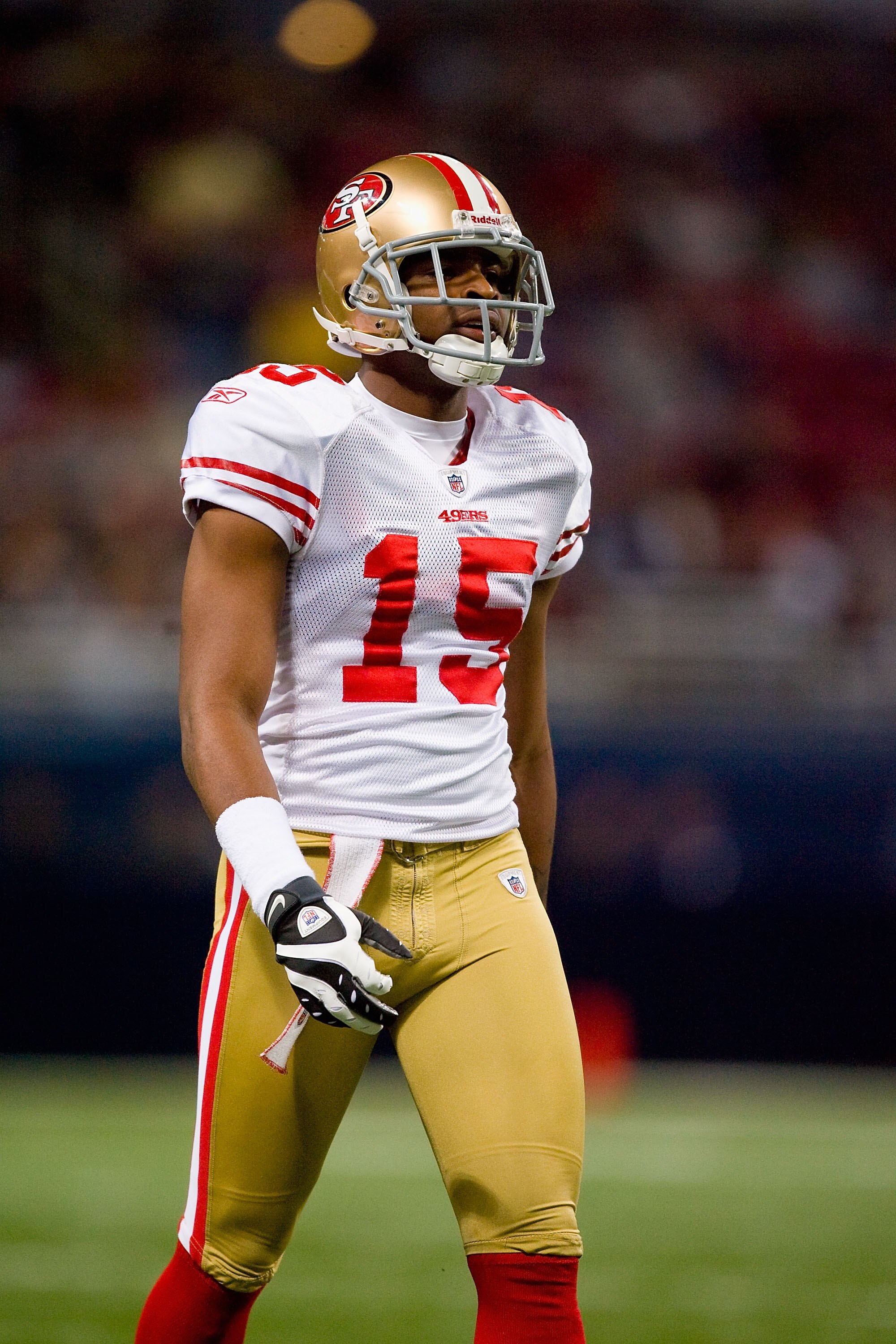 ST. LOUIS - JANUARY 3: Michael Crabtree #15 of the San Francisco 49ers walks on the field during the game against the St. Louis Rams at the Edward Jones Dome on January 3, 2010 in St. Louis, Missouri.  The 49ers beat the Rams 28-6.  (Photo by Dilip Vishwa