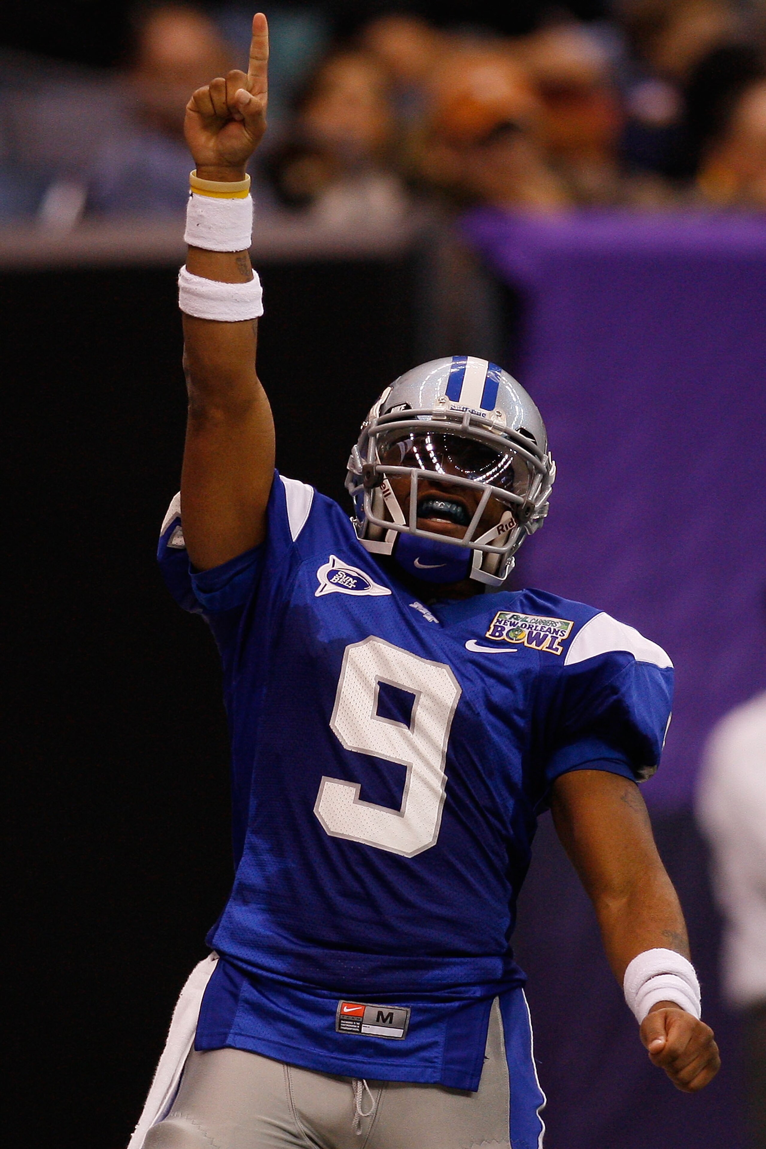 NEW ORLEANS - DECEMBER 20:  Dwight Dasher #9 of the Middle Tennessee Blue Raiders celebrates after scoring a touchdown against the Southern Miss Golden Eagles during the R+L Carriers New Orleans Bowl at the Louisiana Superdome on December 20, 2009 in New