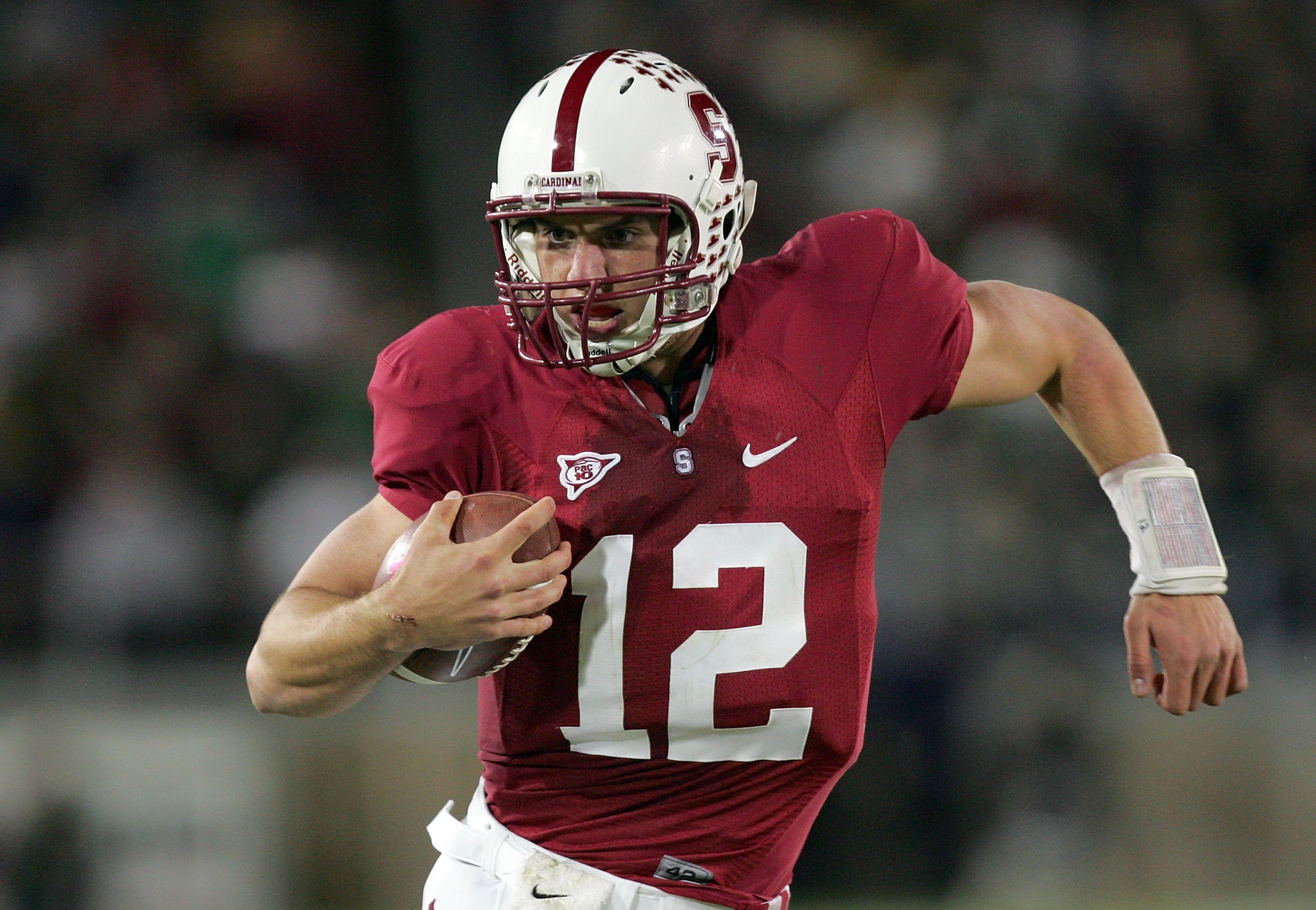 PALO ALTO, CA - NOVEMBER 28:  Andrew Luck #12 of the Stanford Cardinal runs with the ball during their game against the Notre Dame Fighting Irish at Stanford Stadium on November 28, 2009 in Palo Alto, California.  (Photo by Ezra Shaw/Getty Images)
