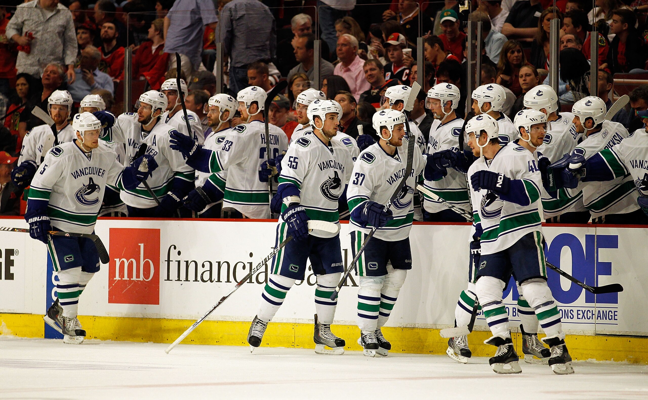CHICAGO - MAY 01: (L-R) Christian Ehrhoff #5, Shane O'Brien #55, Rick Rypien #37 and Michael Grabner #40 of the Vancouver Canucks are congratulated by teammates after Grabner scored a 2nd period goal against the Chicago Blackhawks in Game One of the Weste CHICAGO - MAY 01: (L-R) Christian Ehrhoff #5, Shane O'Brien #55, Rick Rypien #37 and Michael Grabner #40 of the Vancouver Canucks are congratulated by teammates after Grabner scored a 2nd period goal against the Chicago Blackhawks in Game One of the Weste