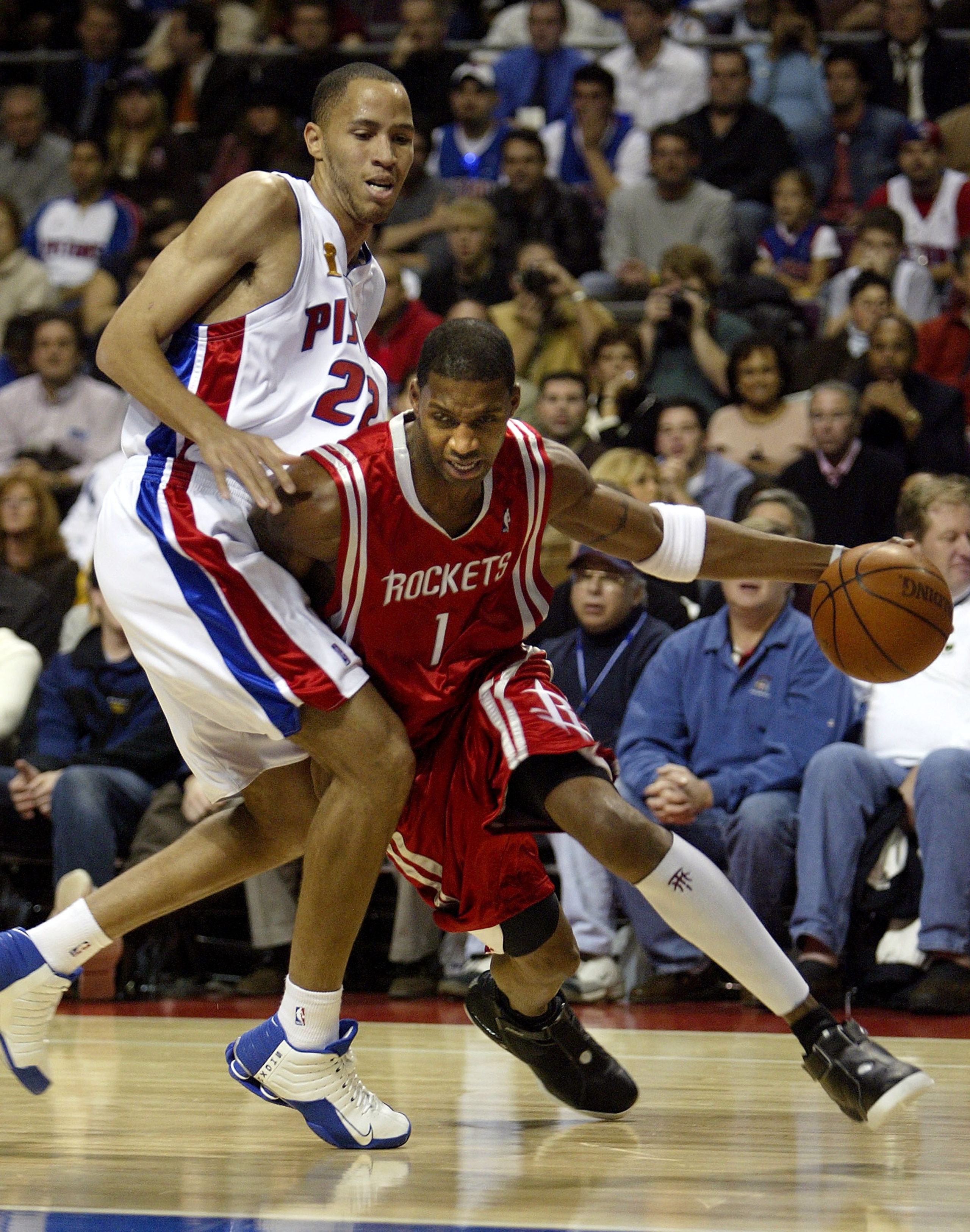 AUBURN HILLS, MI - NOVEMBER 2:  Tracy McGrady #1 of the Houston Rockets drives on Tayshaun Prince #22 of the Detroit Pistons during the first quarter on November 2, 2004 at The Palace of Auburn Hills in Auburn Hills, Michigan.  NOTE TO USER: User expressl