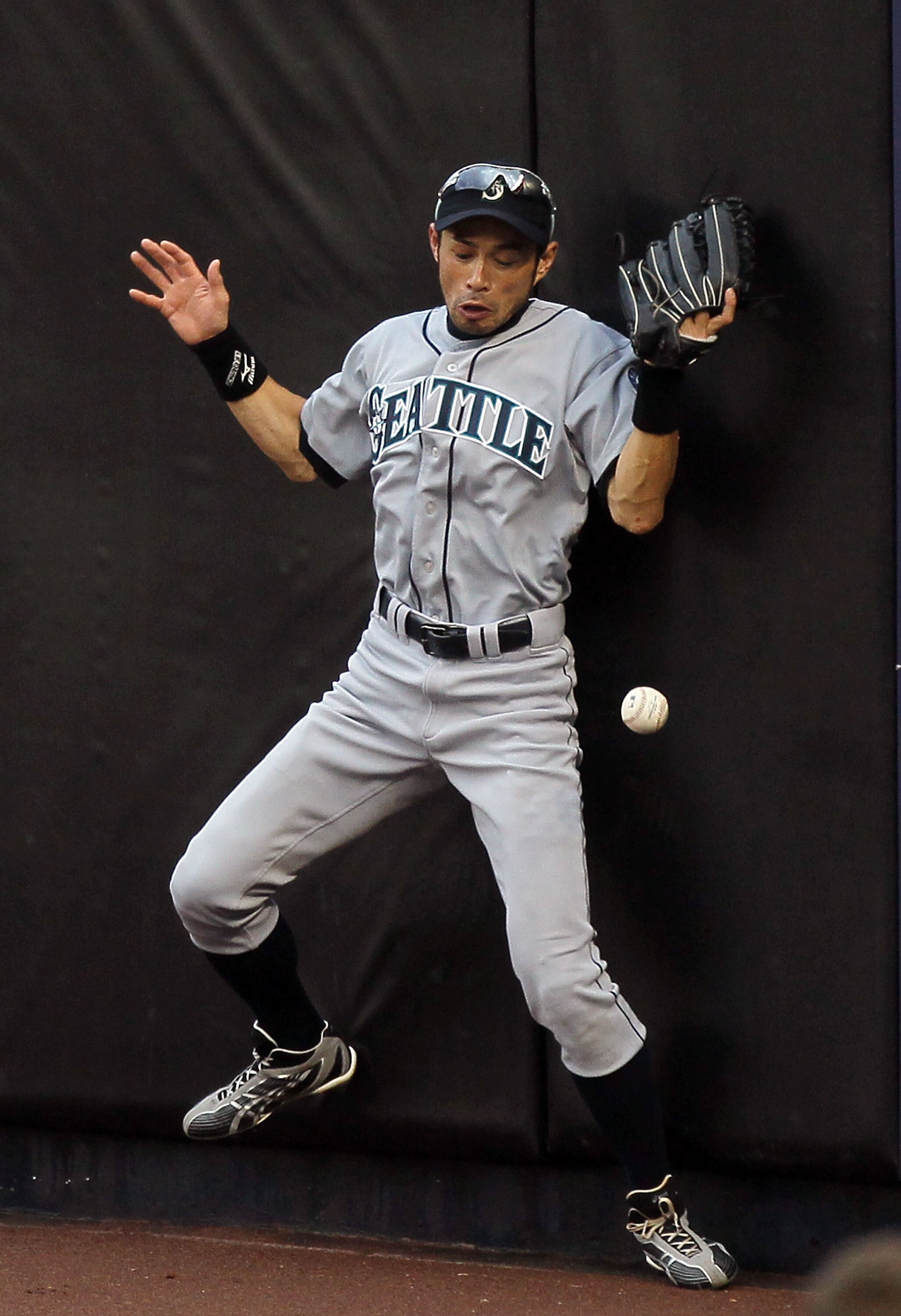 NEW YORK - AUGUST 22:  Ichiro Suzuki #51 of the Seattle Mariners can not keep the ball in his glove on a ball hit for a double by Nick Swisher (not pictured) of the New York Yankees during the fifth inning on August 22, 2010 at Yankee Stadium in the Bronx