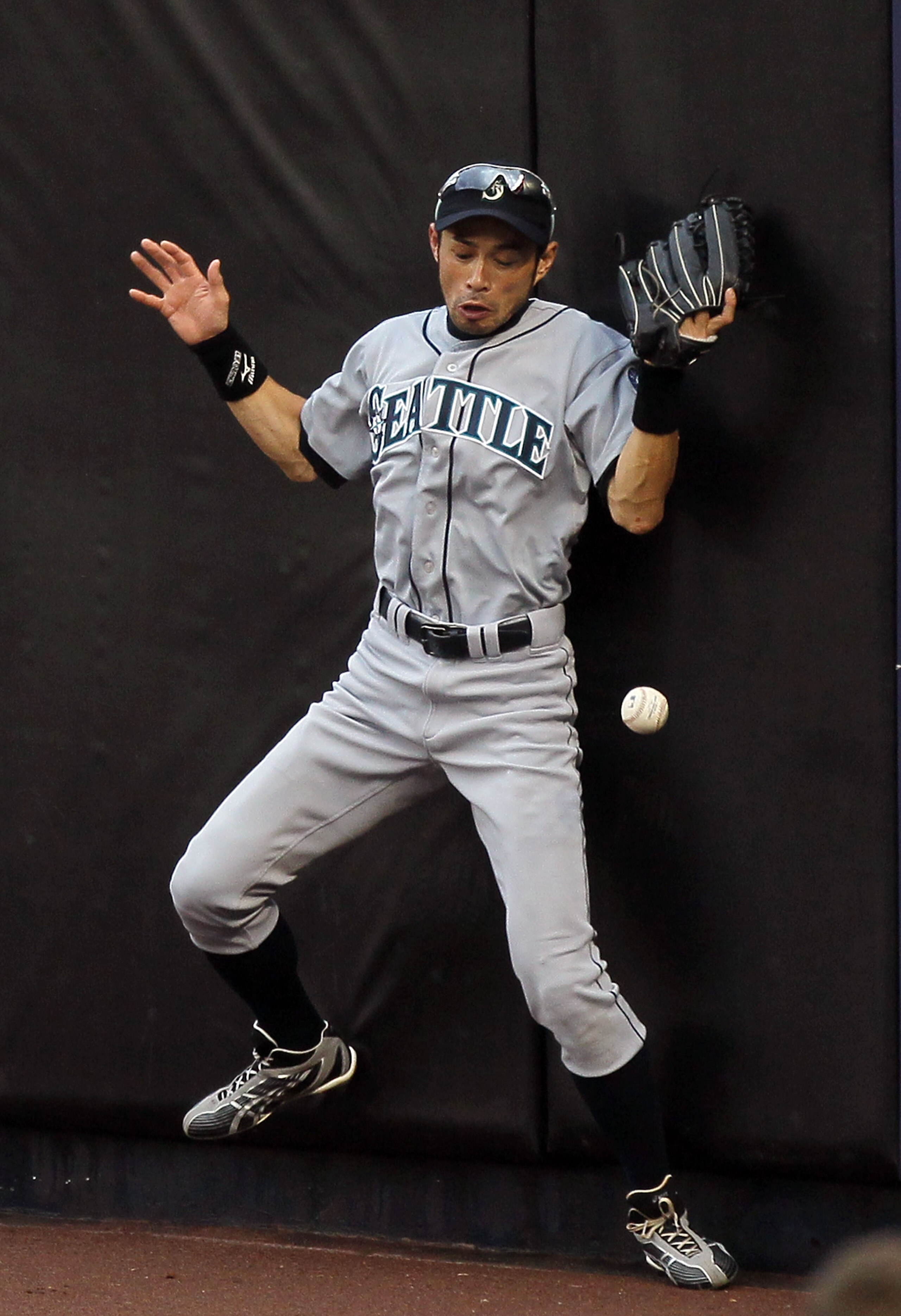 NEW YORK - AUGUST 22:  Ichiro Suzuki #51 of the Seattle Mariners can not keep the ball in his glove on a ball hit for a double by Nick Swisher (not pictured) of the New York Yankees during the fifth inning on August 22, 2010 at Yankee Stadium in the Bronx