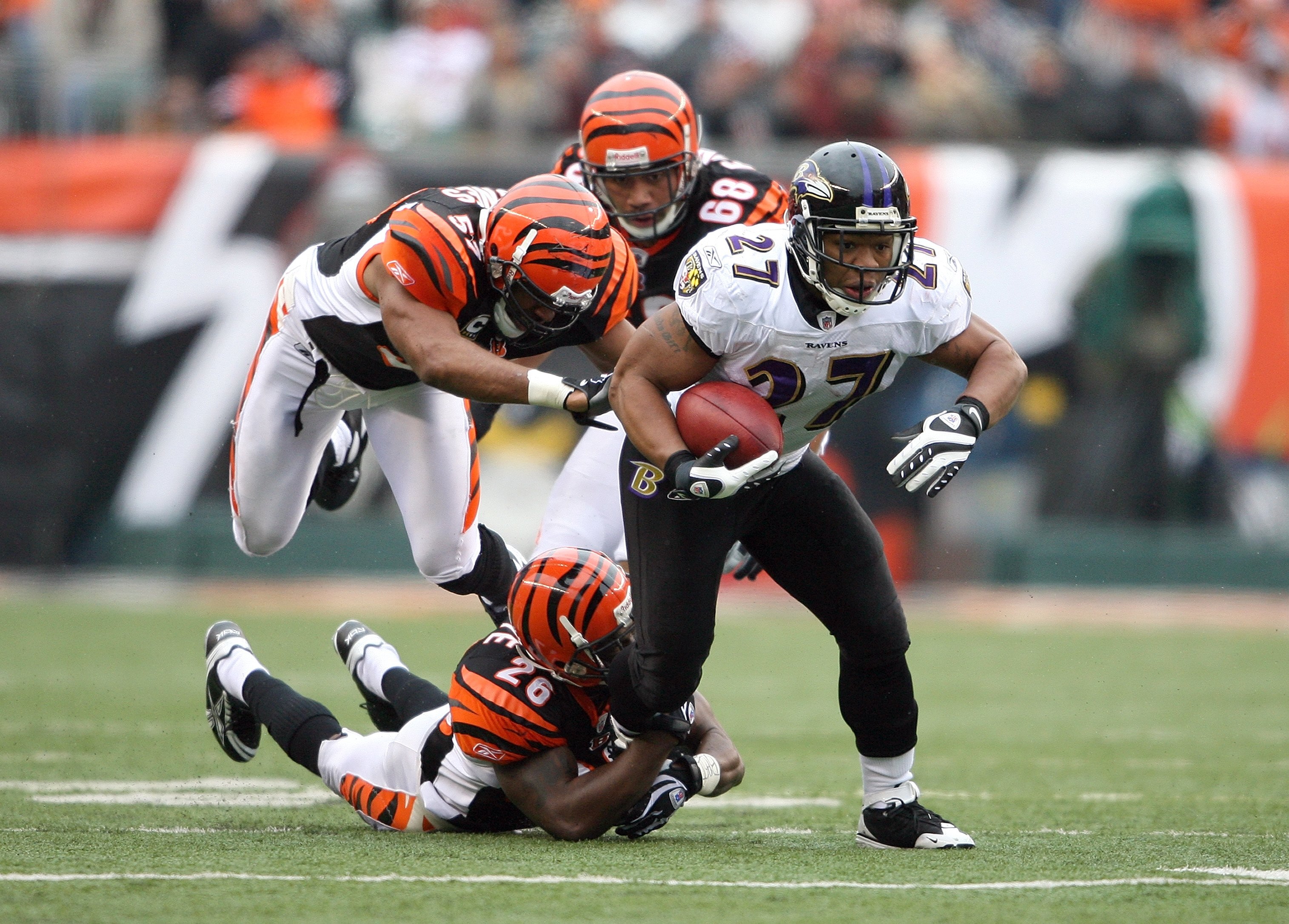 CINCINNATI - NOVEMBER 30: Running back Ray Rice #27 of the Baltimore Ravens runs with the ball away from Marvin White #26 of the Cincinnati Bengals during their NFL game on November 30, 2008 at Paul Brown Stadium in Cincinnati, Ohio. The Ravens defeated t