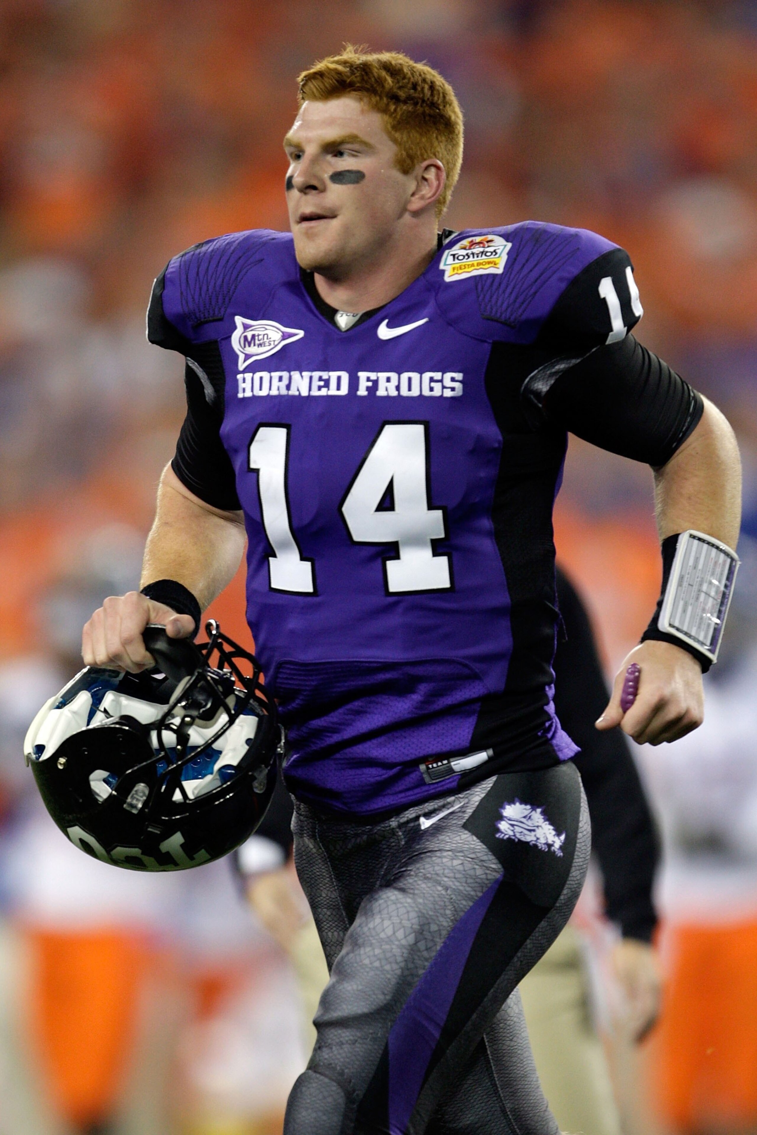 GLENDALE, AZ - JANUARY 04:  Quarterback Andy Dalton #14 of the TCU Horned Frogs runs off the field against the Boise State Broncos during the Tostitos Fiesta Bowl at the Universtity of Phoenix Stadium on January 4, 2010 in Glendale, Arizona.  (Photo by Ja