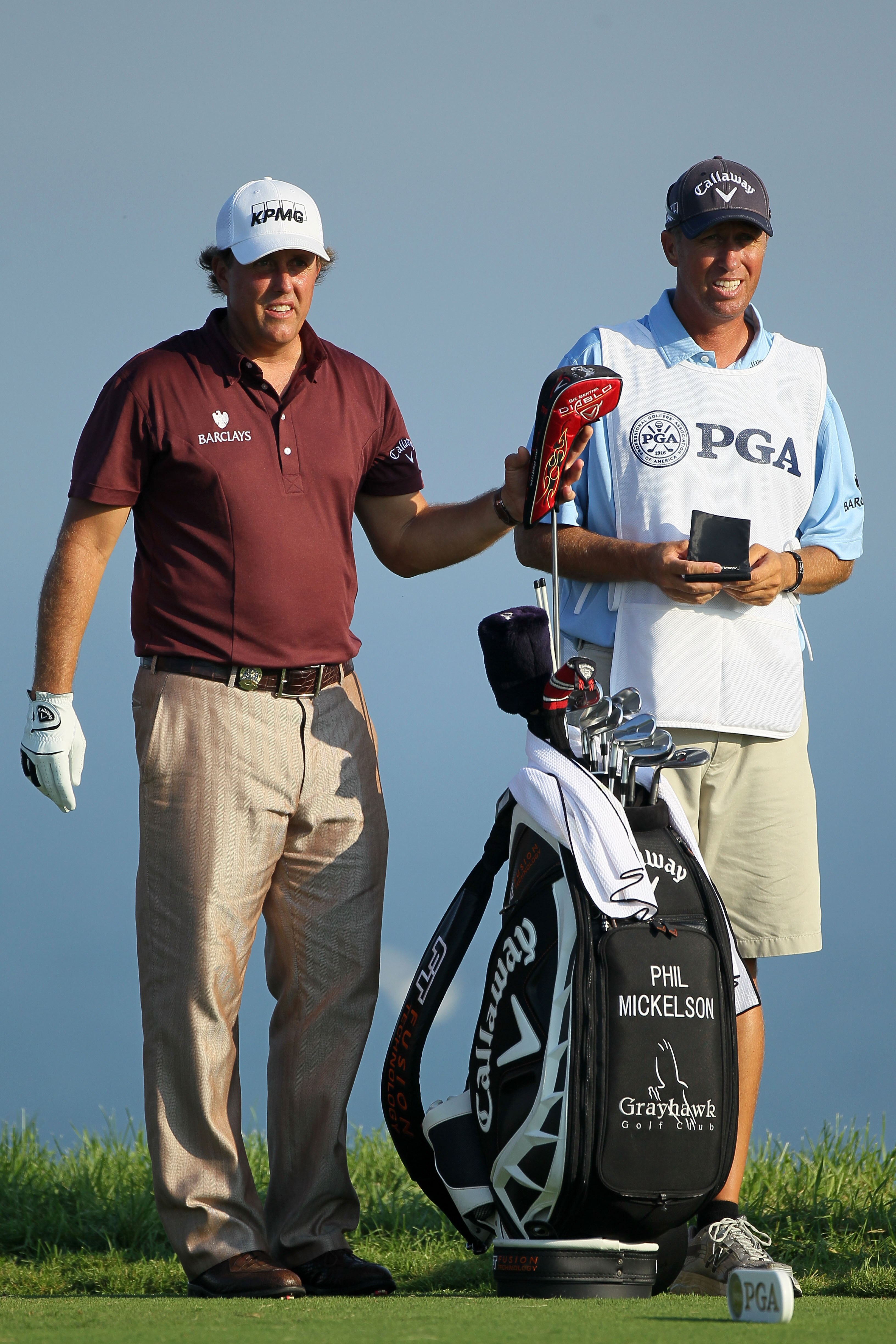 KOHLER, WI - AUGUST 12:  Phil Mickelson waits with his caddie Jim Mackay on the fifth hole during the first round of the 92nd PGA Championship on the Straits Course at Whistling Straits on August 12, 2010 in Kohler, Wisconsin.  (Photo by Andy Lyons/Getty
