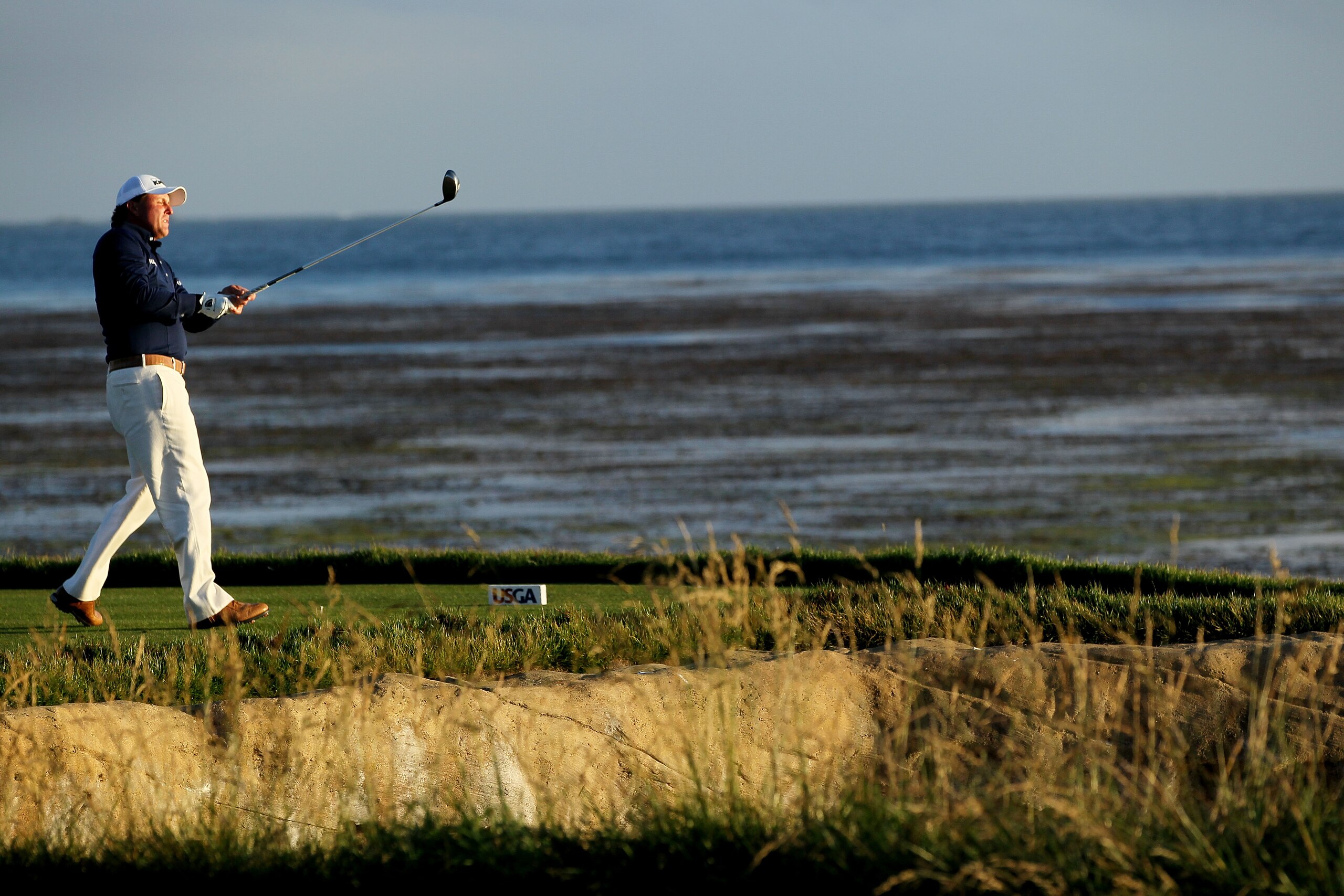 PEBBLE BEACH, CA - JUNE 19:  Phil Mickelson watches his tee shot on the 18th hole during the third round of the 110th U.S. Open at Pebble Beach Golf Links on June 19, 2010 in Pebble Beach, California.  (Photo by Jeff Gross/Getty Images)