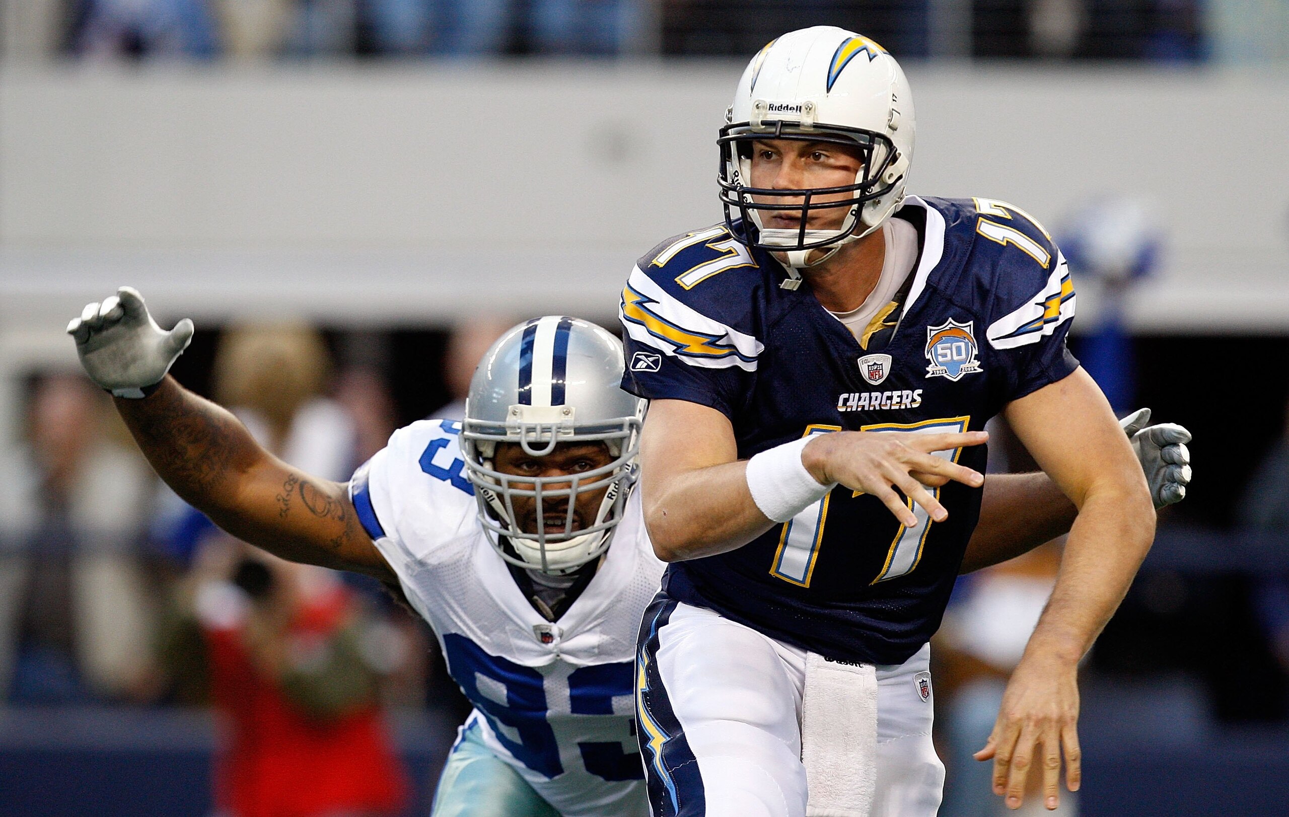 ARLINGTON, TX - DECEMBER 13:  Quarterback Philip Rivers #17 of the San Diego Chargers throws the ball in front of Anthony Spencer #93 of the Dallas Cowboys at Cowboys Stadium on December 13, 2009 in Arlington, Texas.  (Photo by Ronald Martinez/Getty Image