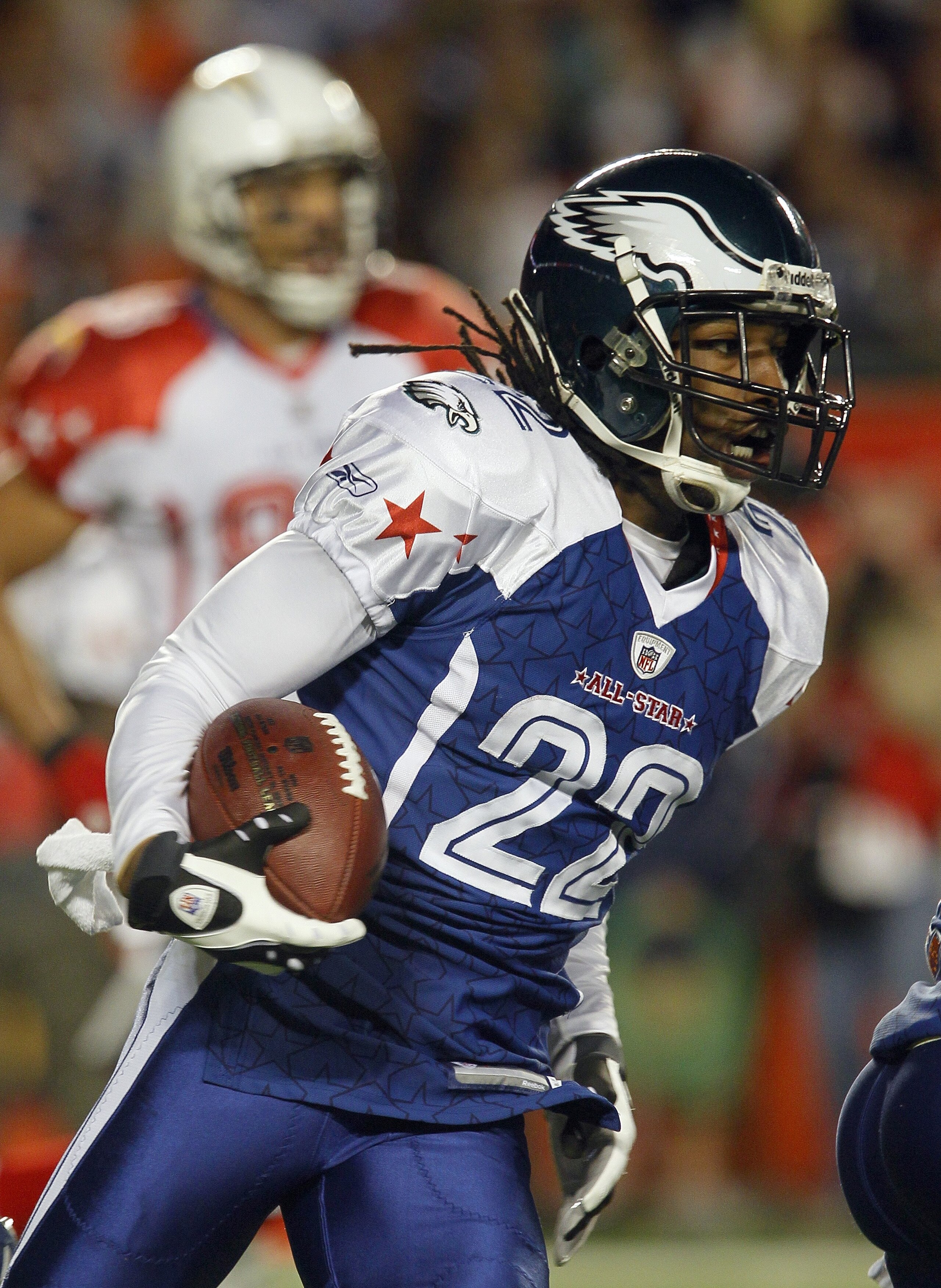 MIAMI GARDENS, FL - JANUARY 31:  Asante Samuel #22 of the NFC's Philadelphia Eagles runs with the ball for yardage during the 2010 AFC-NFC Pro Bowl game at Sun Life Stadium on January 31, 2010 in Miami Gardens, Florida. The AFC defeated the NFC 41-34. (Ph