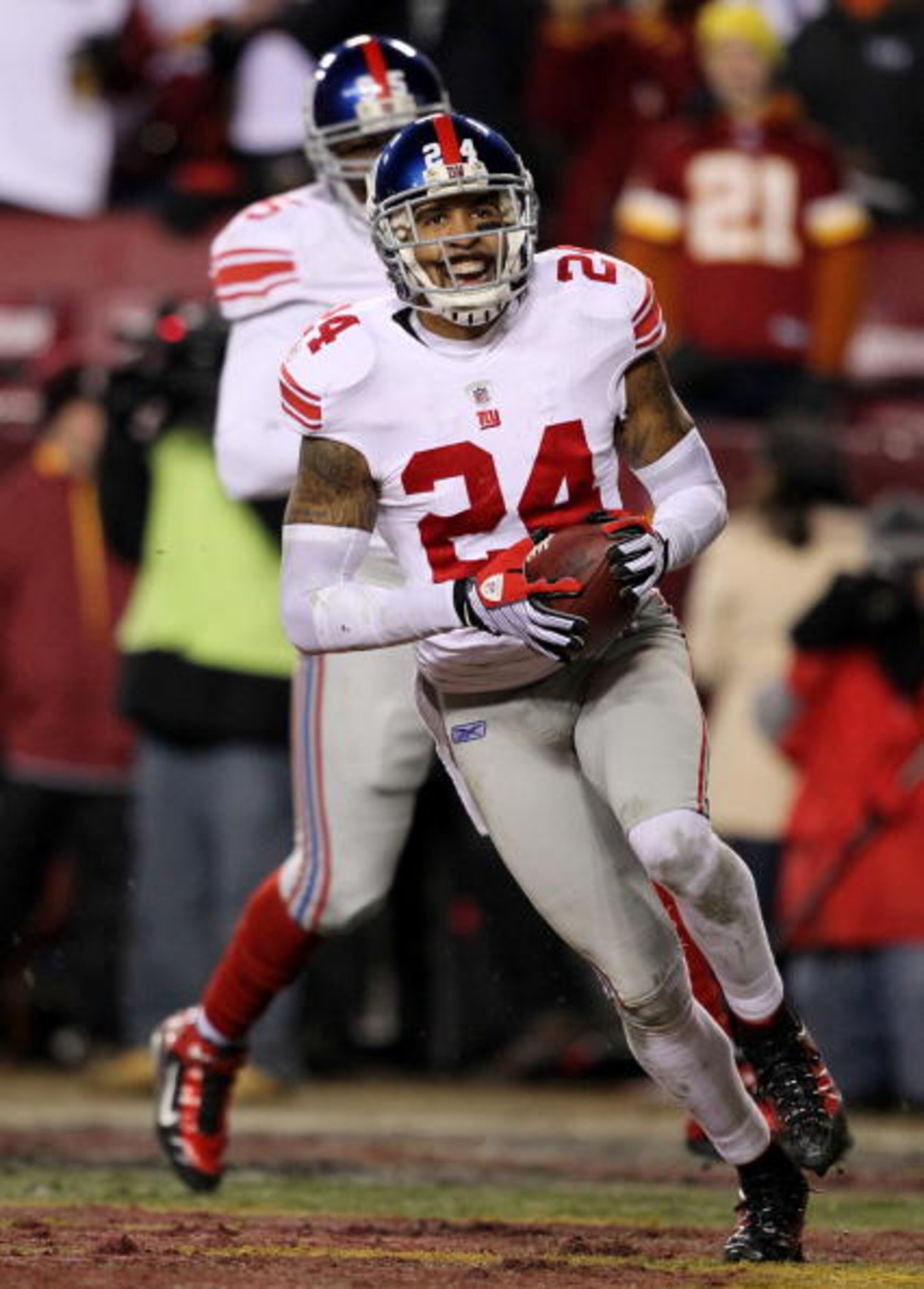 LANDOVER, MD - DECEMBER 21:  Terrell Thomas #24 of the New York Giants reacts after returning a third-quarter interception for a touchdown against the Washington Redskins at FedEx Field on December 21, 2009 in Landover, Maryland. (Photo by Al Bello/Getty