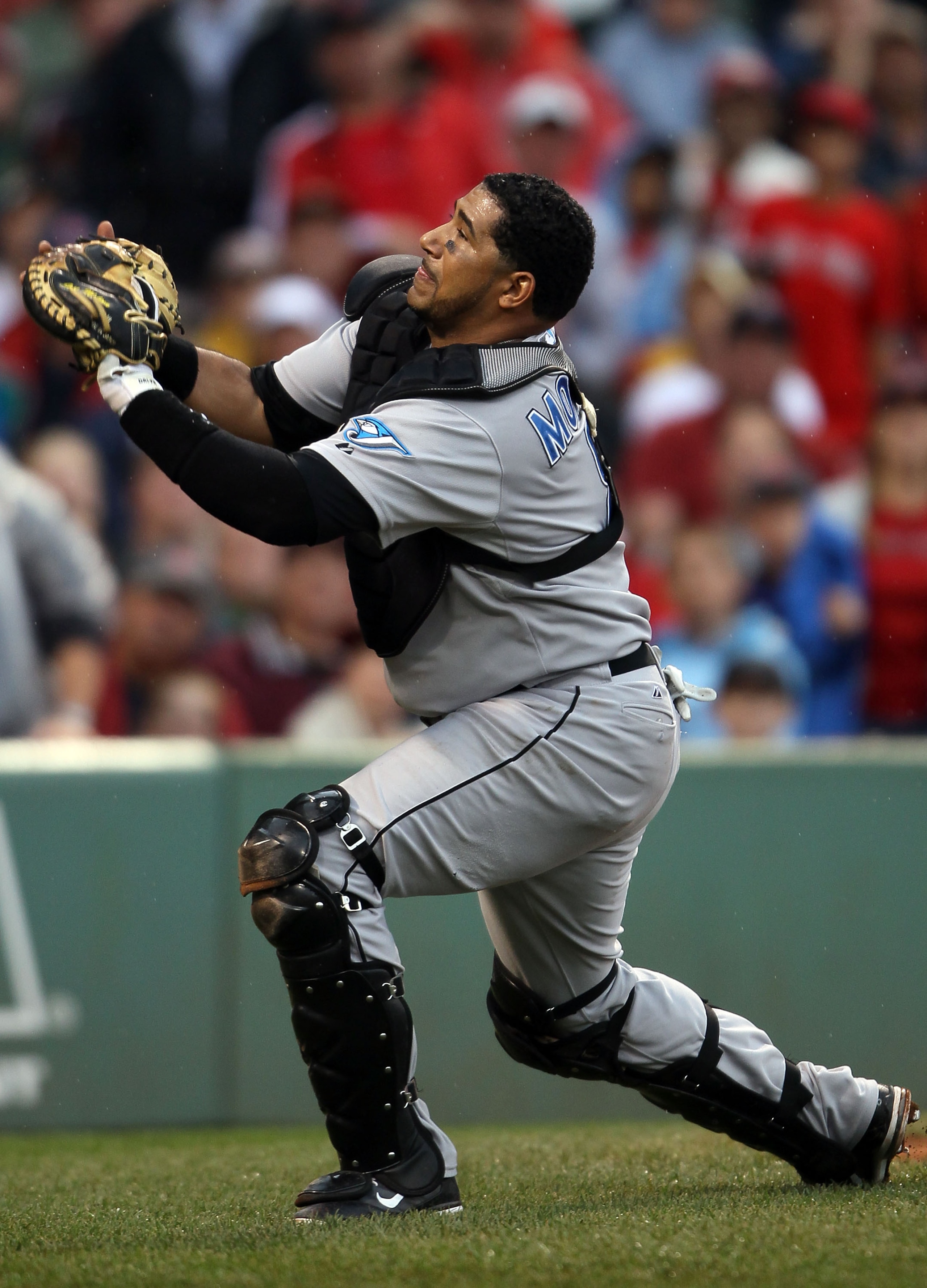 BOSTON - AUGUST 22:  Jose Molina #8 of the Toronto Blue Jays catches a foul ball to get out David Ortiz of the Boston Red Sox on August 22, 2010 at Fenway Park in Boston, Massachusetts.  (Photo by Elsa/Getty Images)