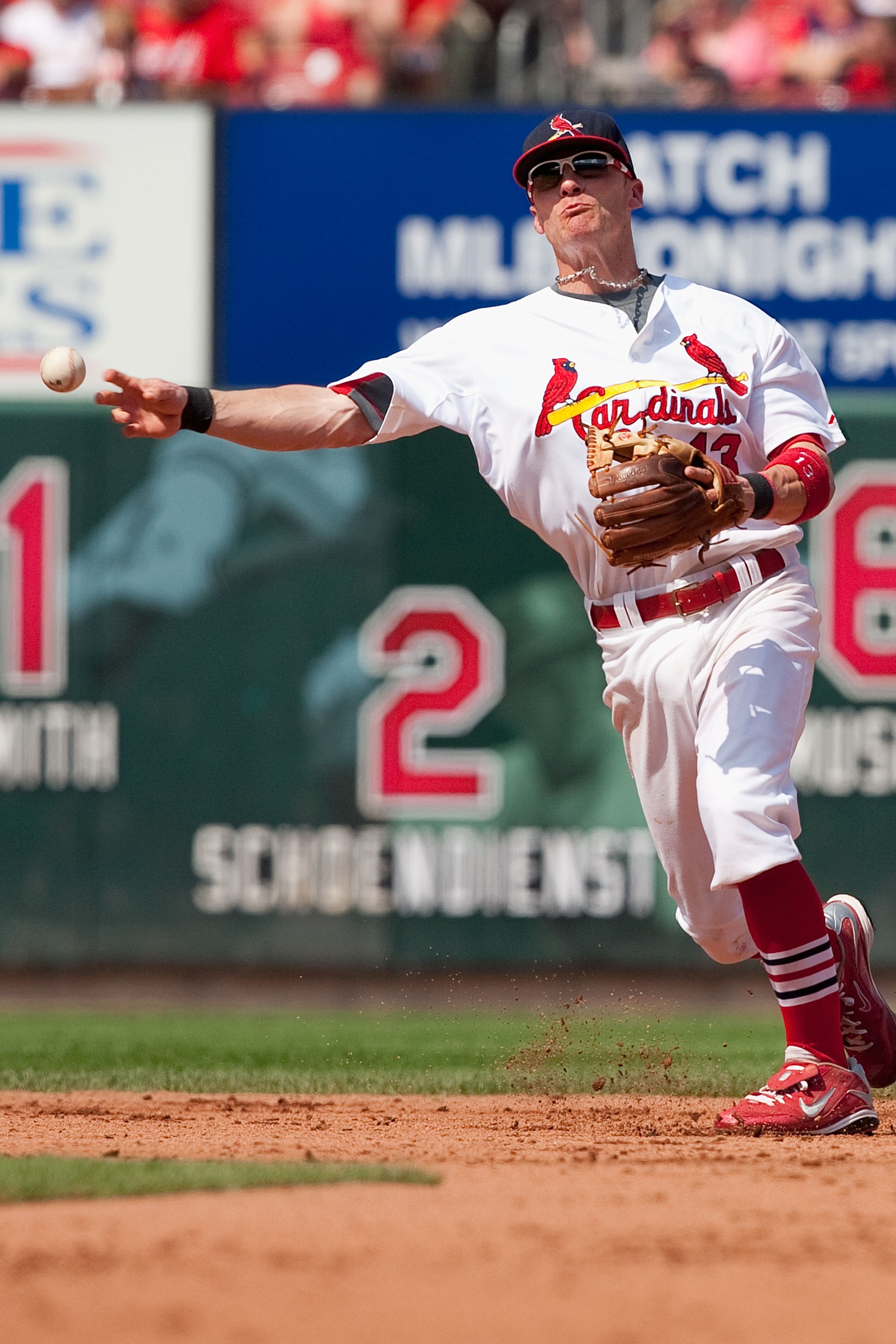 ST. LOUIS - AUGUST 22: Brendan Ryan #13 of the St. Louis Cardinals throws to first base against the San Francisco Giants at Busch Stadium on August 22, 2010 in St. Louis, Missouri.  (Photo by Dilip Vishwanat/Getty Images)