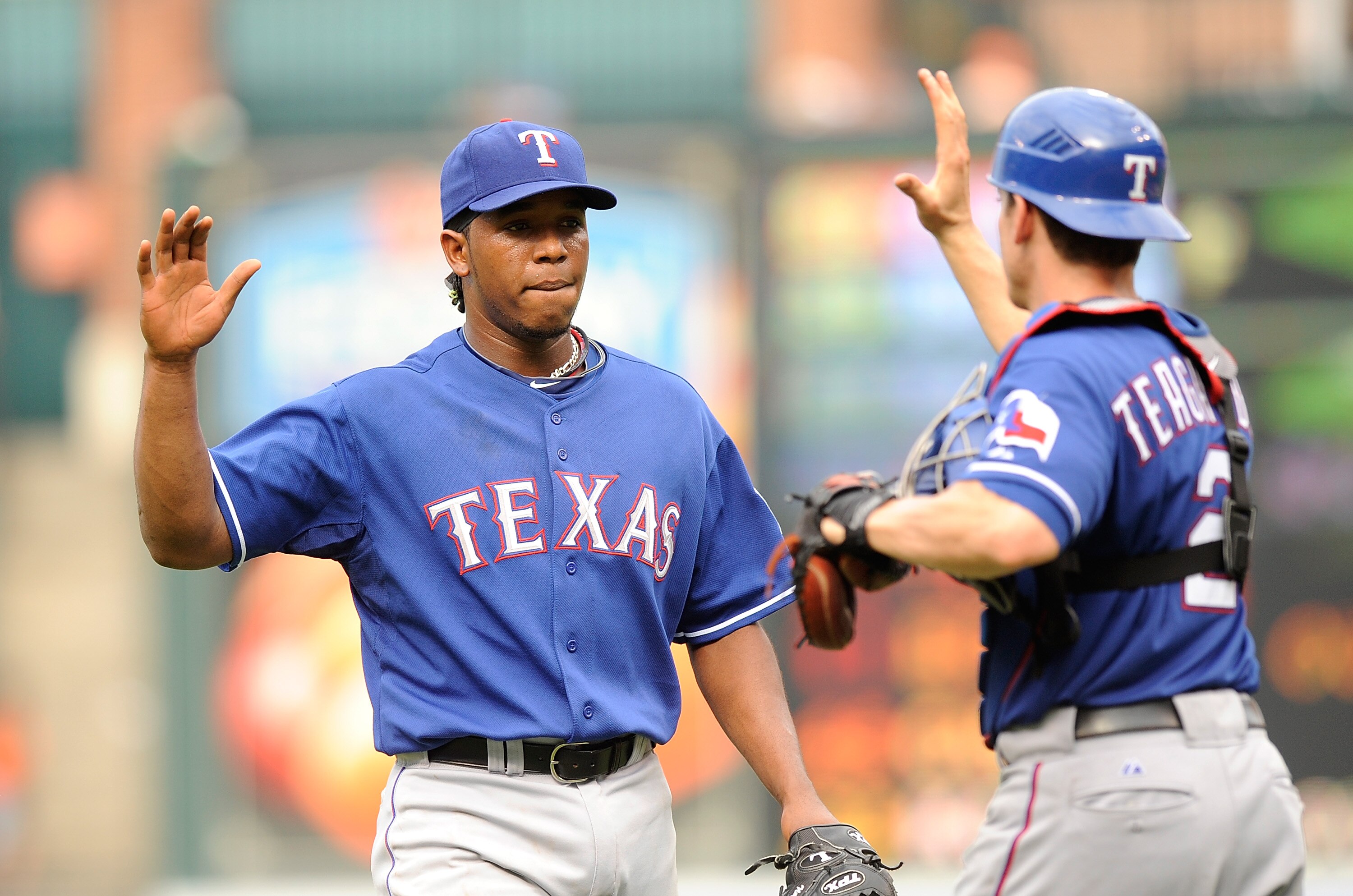 BALTIMORE - AUGUST 22:  Neftali Feliz #30 of the Texas Rangers celebrates with Taylor Teagarden #2 after a 6-4 victory against the Baltimore Orioles at Camden Yards on August 22, 2010 in Baltimore, Maryland.  (Photo by Greg Fiume/Getty Images)