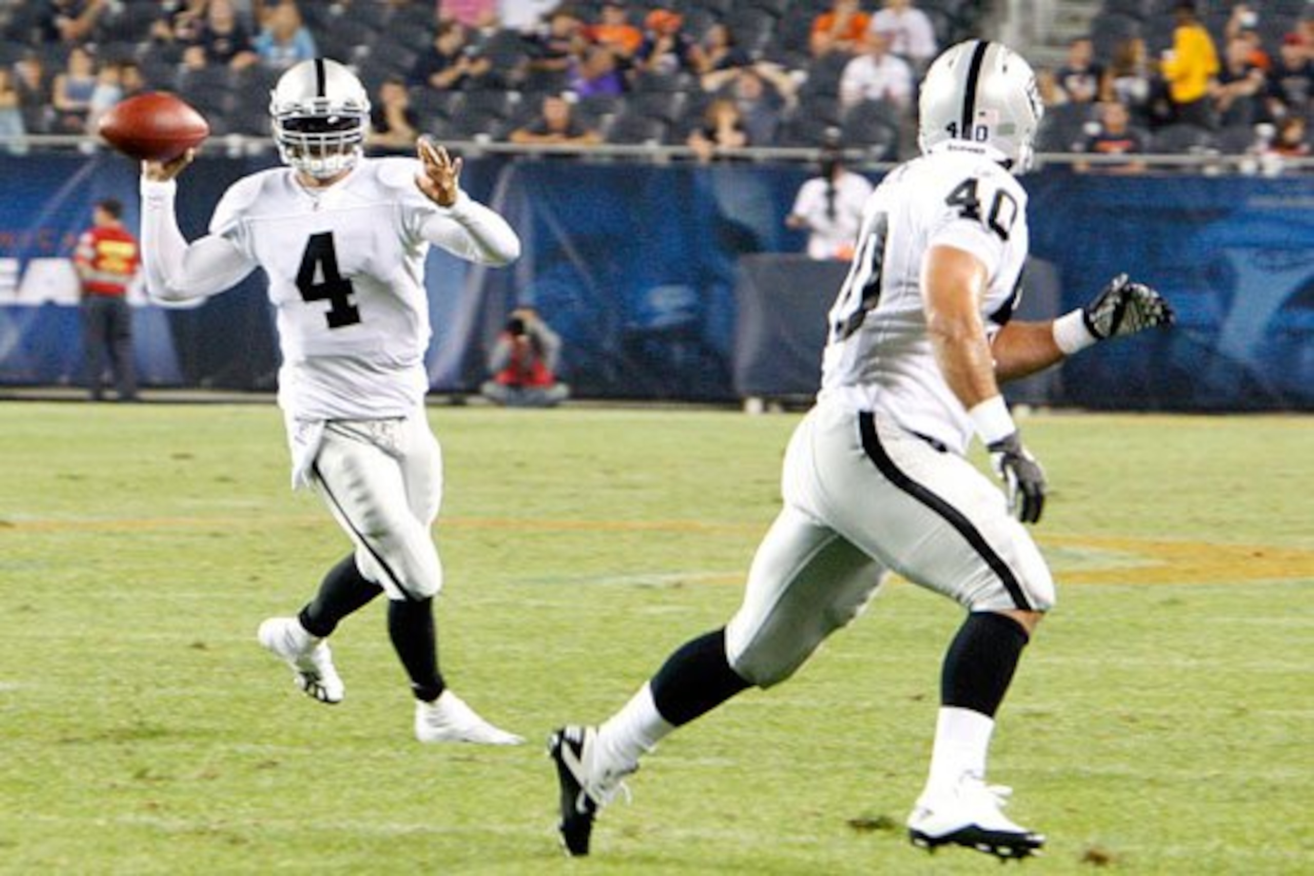 Colt Brennan rolls left and completes it to Chane Moline for 14 yards.