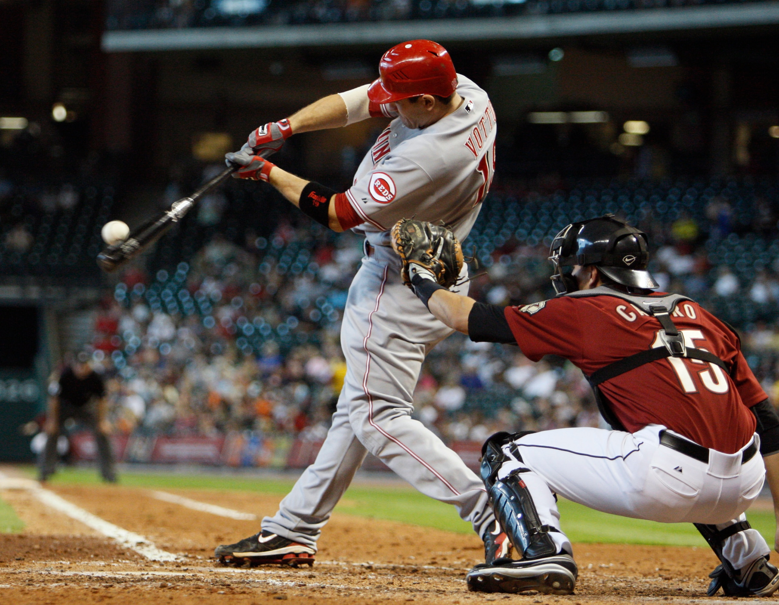 HOUSTON - JULY 25:  Joey Votto #19 of the Cincinnati Reds flies out to center field during the first inning against the Houston Astros at Minute Maid Park on July 25, 2010 in Houston, Texas.  (Photo by Bob Levey/Getty Images)