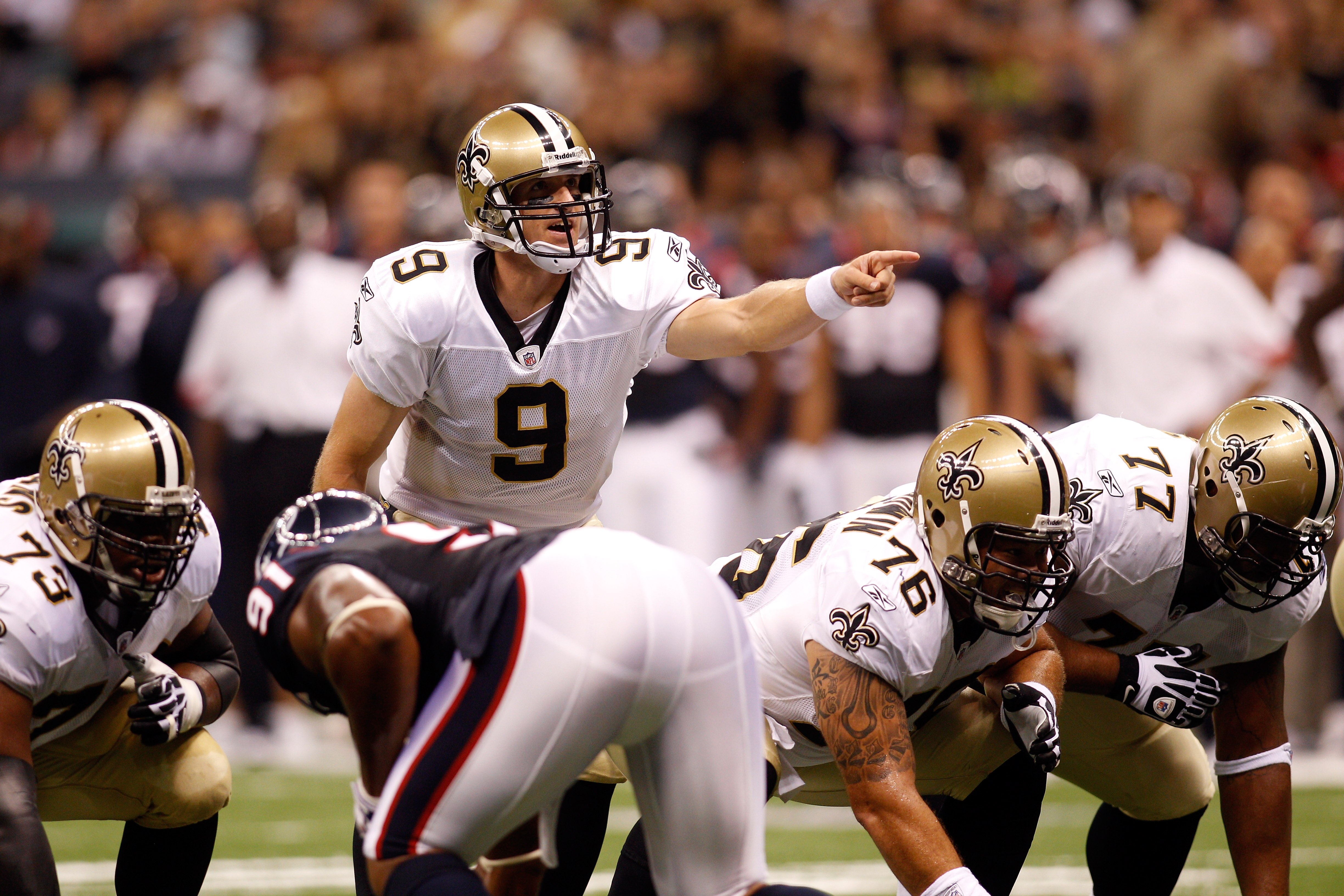 NEW ORLEANS - AUGUST 21:  Quarterback Drew Brees #9 of the New Orleans Saints calls a play against the Houston Texans at the Louisiana Superdome on August 21, 2010 in New Orleans, Louisiana.   The Saints defeated the Texans 38-20.  (Photo by Chris Graythe