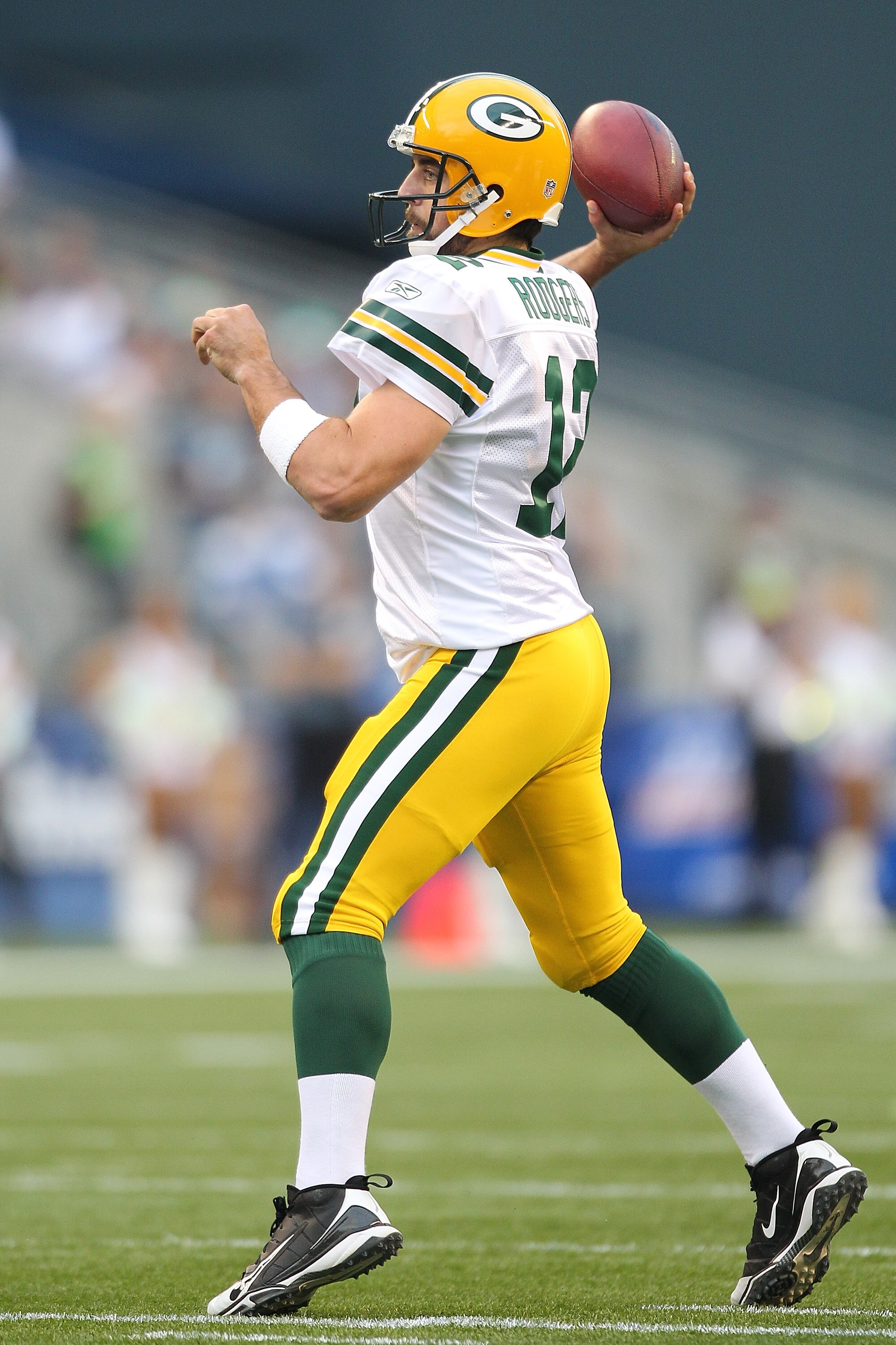 SEATTLE - AUGUST 21:  Quarterback Aaron Rodgers #12 of the Green Bay Packers passes during the preseason game against the Seattle Seahawks at Qwest Field on August 21, 2010 in Seattle, Washington. (Photo by Otto Greule Jr/Getty Images)