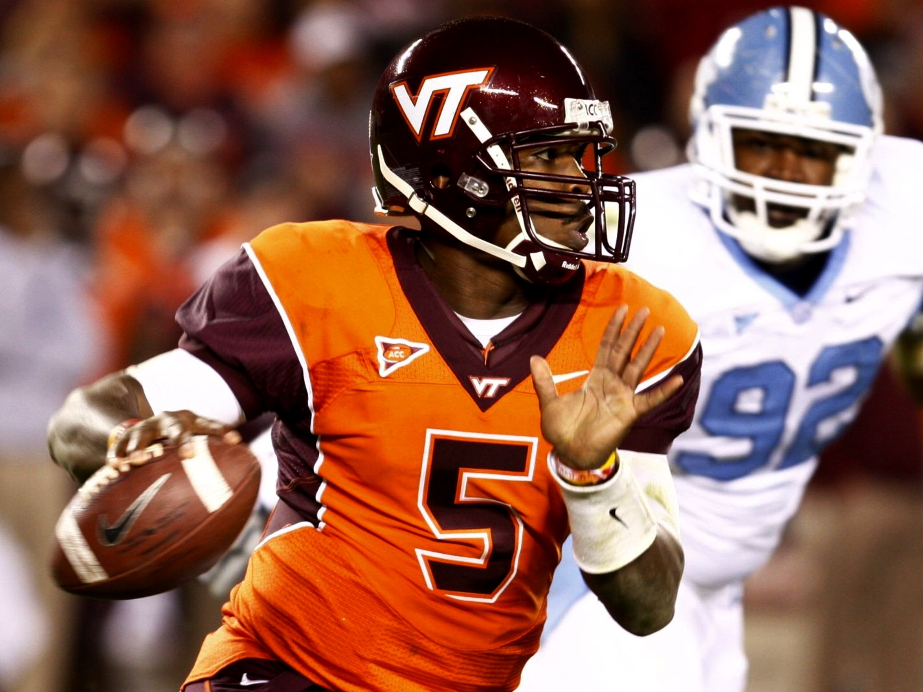 BLACKSBURG, VA - OCTOBER 29:  Quarterback Tyrod Taylor #5 of the Virginia Tech University Hokies looks to pass the ball against E.J. Wilson #92 of the North Carolina Tar Heels during the first quarter of the game at Lane Stadium on October 29, 2009 in Bla