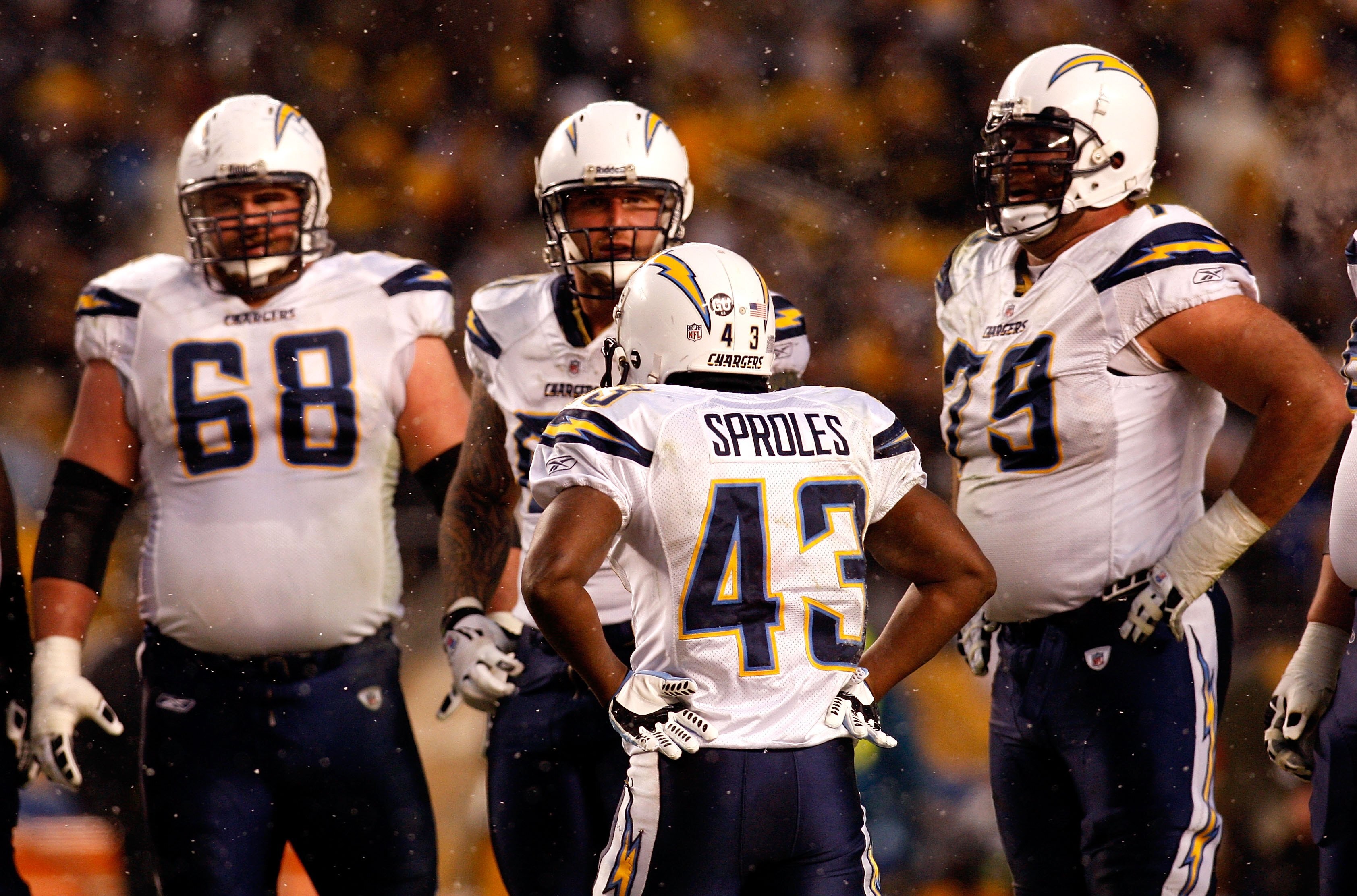 PITTSBURGH - JANUARY 11:  Darren Sproles #43 of the San Diego Chargers stands in the offensive huddle with Kris Dielman #68 Nick Hardwick #61 and Mike Goff #79 against the Pittsburgh Steelers during their AFC Divisional Playoff Game on January 11, 2009 at