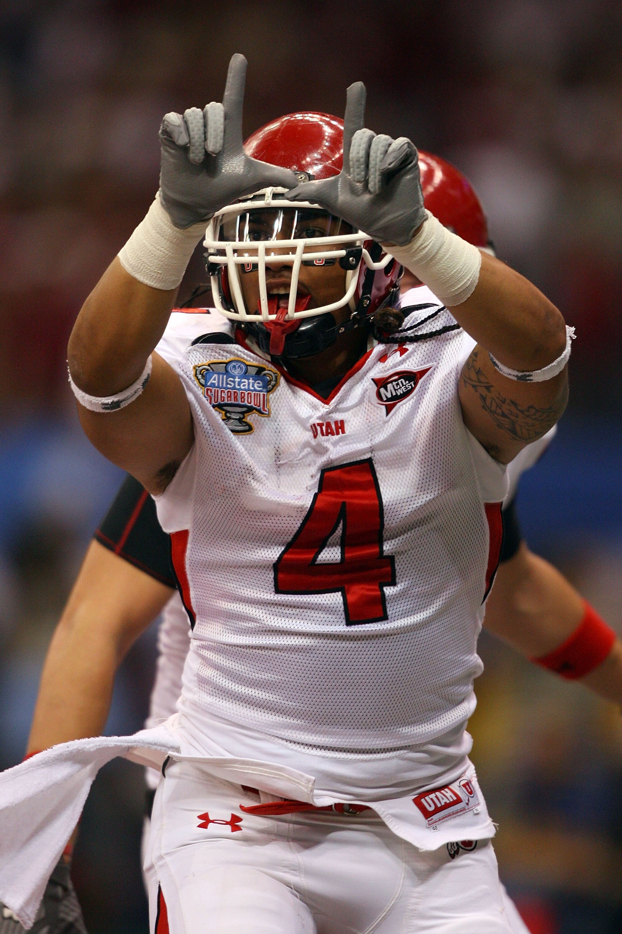 NEW ORLEANS - JANUARY 02:  Matt Asiata #4 of the Utah Utes reacts after he scores a two-yard touchdown in the first quarter against the Alabama Crimson Tide during the 75th Allstate Sugar Bowl at the Louisiana Superdome on January 2, 2009 in New Orleans, 