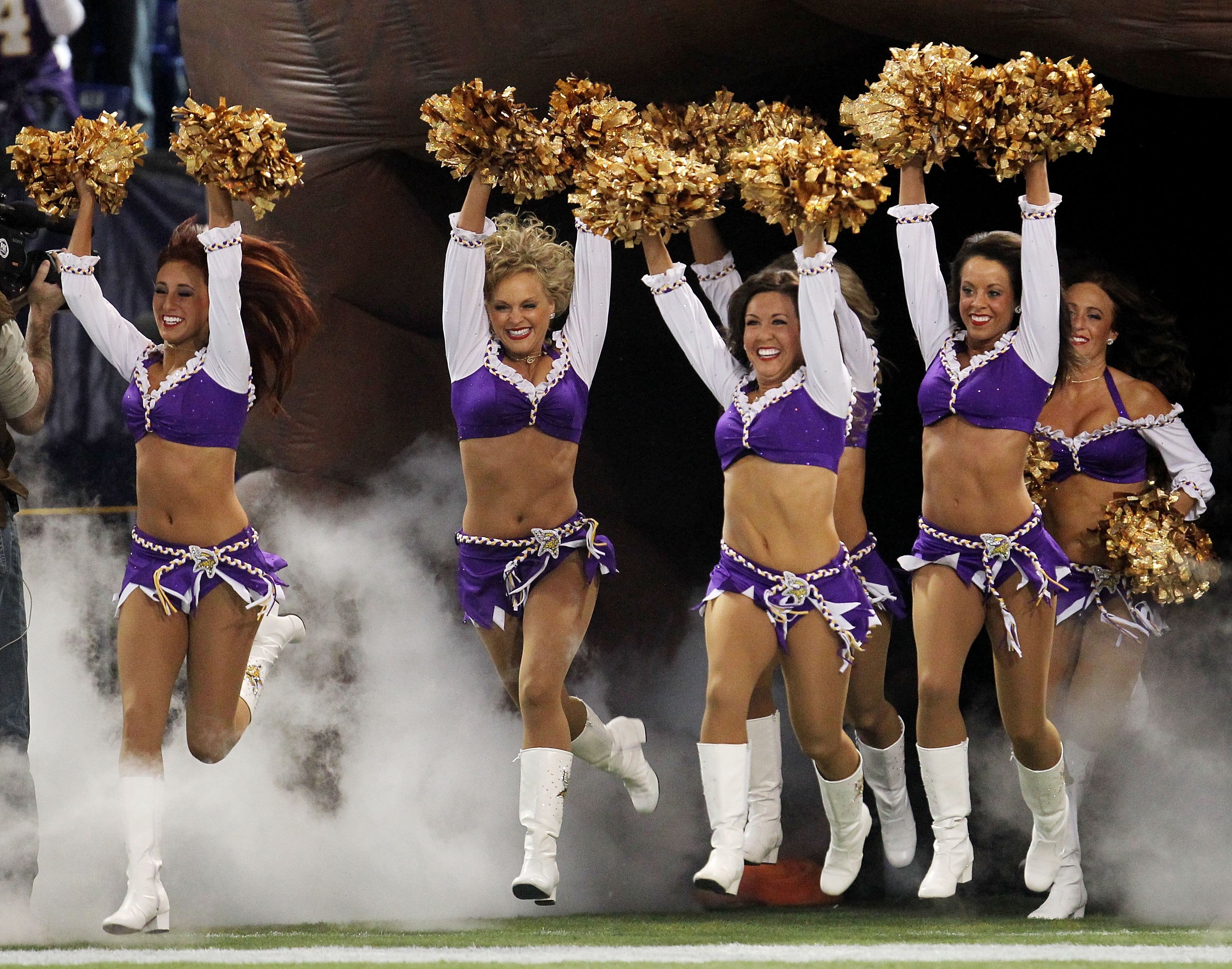 MINNEAPOLIS - JANUARY 17:  The Minnesotd Vikings cheerleaders enter the field before the game against #the Dallas Cowboys during the NFC Divisional Playoff Game at Hubert H. Humphrey Metrodome on January 17, 2010 in Minneapolis, Minnesota. The Vikings def