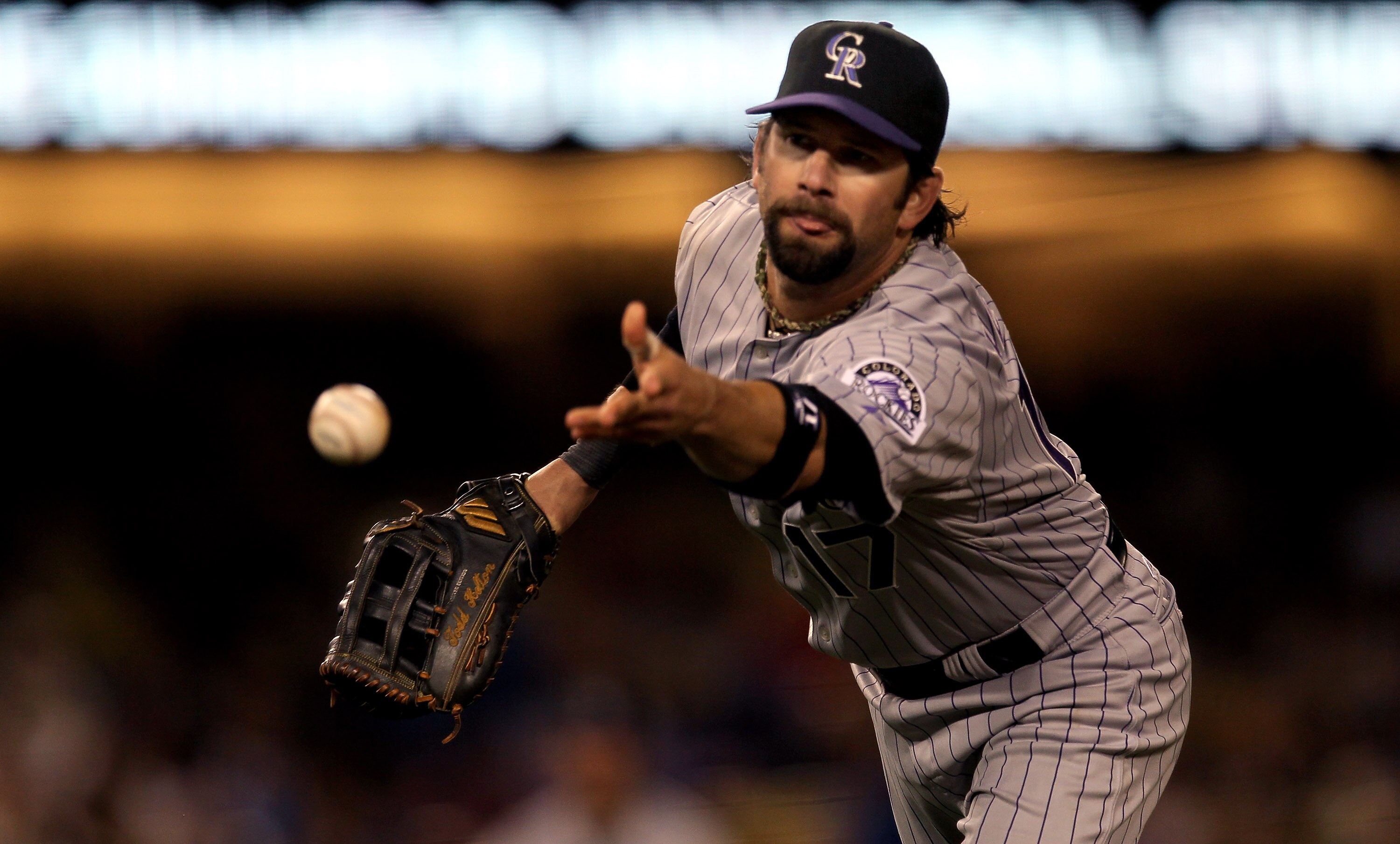 LOS ANGELES - MAY 8:  First baseman Todd Helton #17 of the Colorado Rockies flips the ball to first to force out Matt Kemp of the Los Angeles Dodgers to end the fifth inning on May 8, 2010 at Dodger Stadium in Los Angeles, California.  (Photo by Stephen D