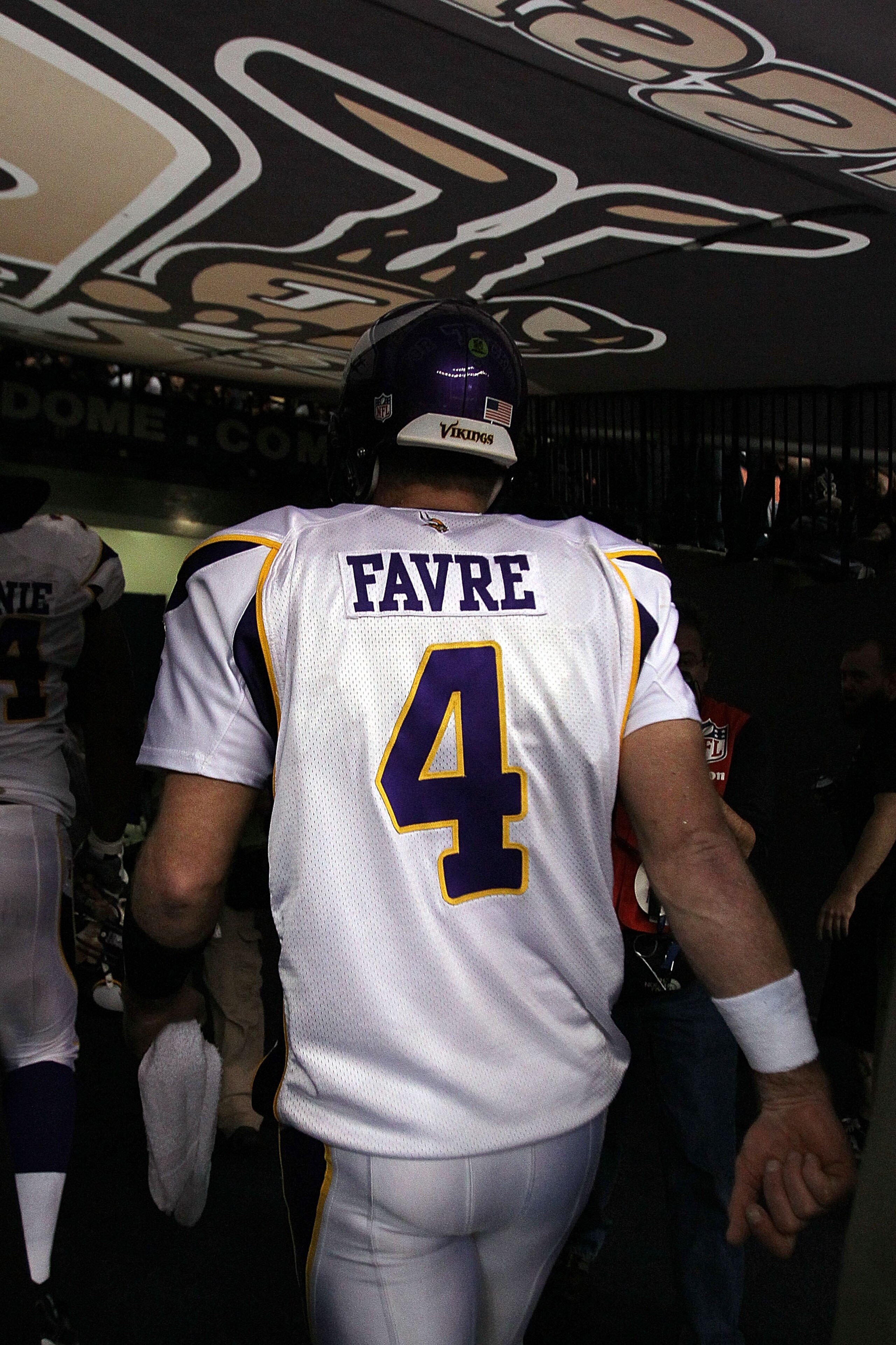 NEW ORLEANS - JANUARY 24:  Brett Favre #4 of the Minnesota Vikingswalks off of the field after losing against the New Orleans Saints in the NFC Championship Game at the Louisiana Superdome on January 24, 2010 in New Orleans, Louisiana.  (Photo by Jed Jaco