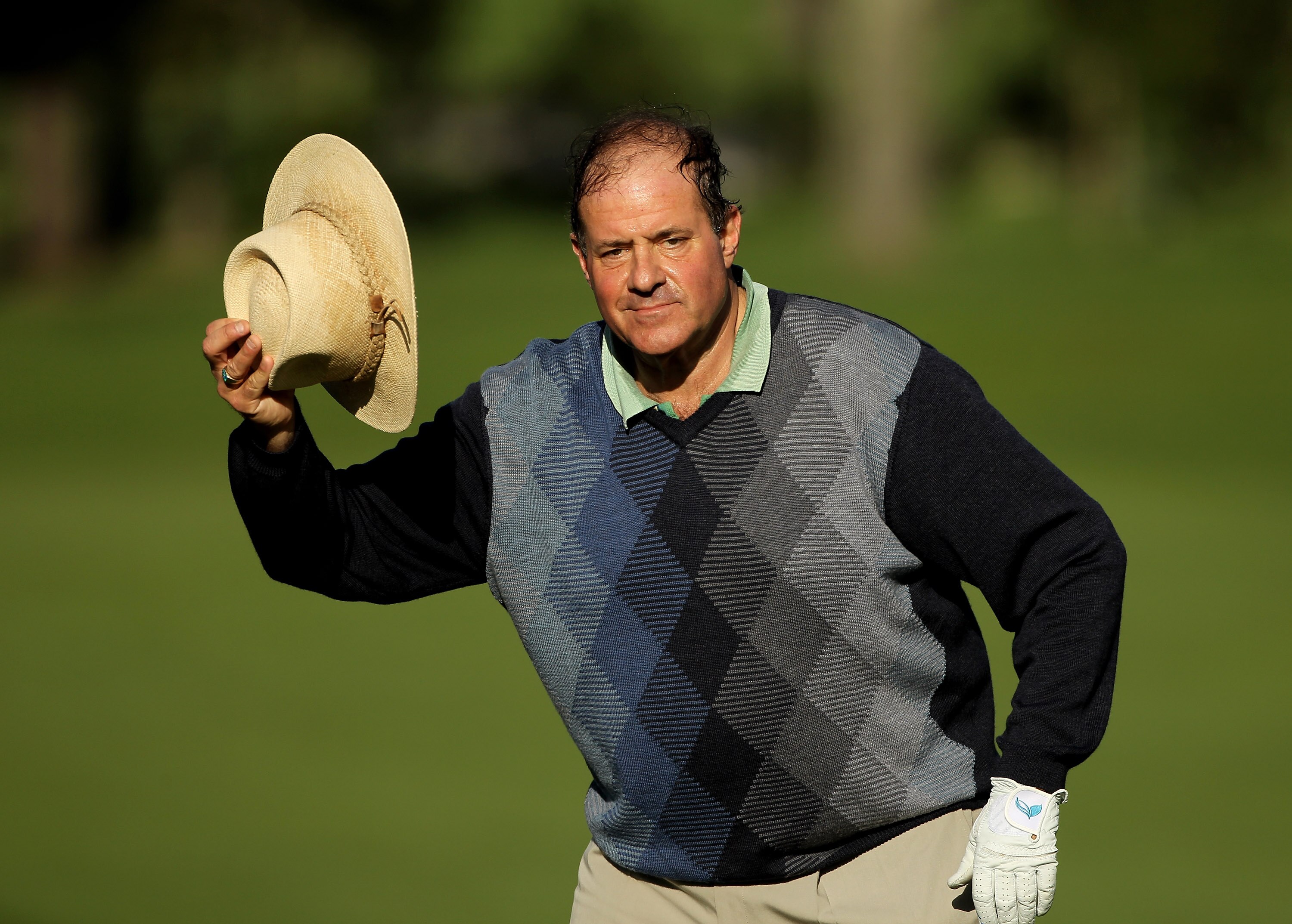 PEBBLE BEACH, CA - FEBRUARY 11:  Chris Berman tips his hat before finishing on the ninth hole during the first round of the AT&T Pebble Beach National Pro-Am at at the Spyglass Hill Golf Course on February 11, 2010 in Pebble Beach, California.  (Photo by 
