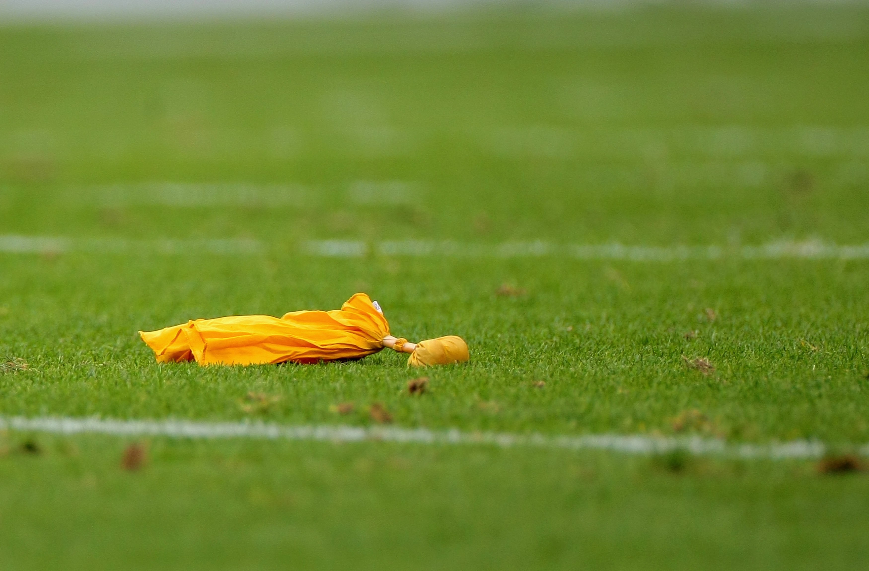 DENVER - SEPTEMBER 20:  A penalty flag lies on the turf as the Cleveland Browns face the Denver Broncos during NFL action at Invesco Field at Mile High on September 20, 2009 in Denver, Colorado. The Broncos defeated the Browns 27-6.  (Photo by Doug Pensin