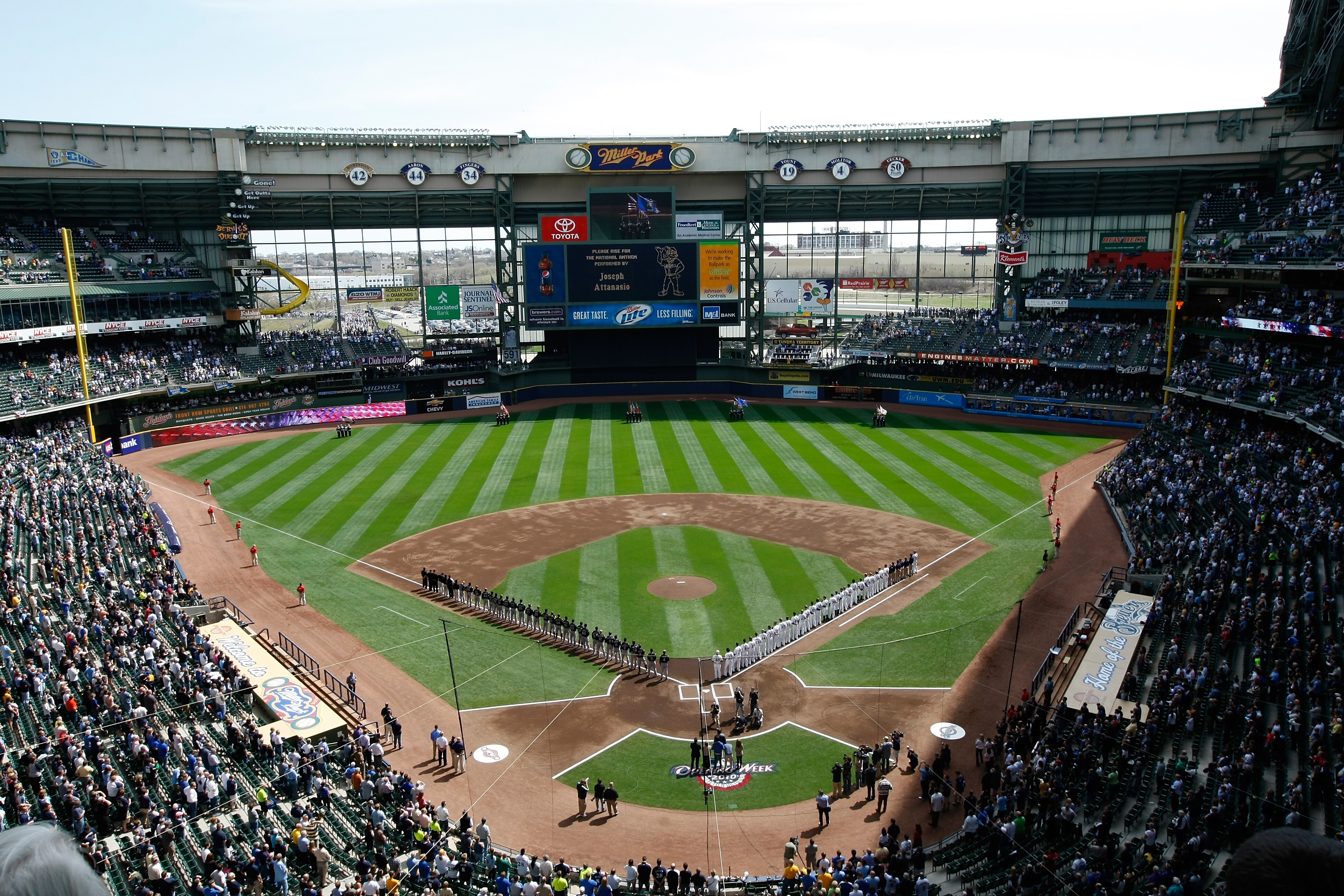 MILWAUKEE, WI - APRIL 05: The Colorado Rockies and Milwaukee Brewers line up on the base lines after introductions during the National Anthem prior to the game between the Colorado Rockies against the Milwaukee Brewers at the Miller Park on April 05, 2010