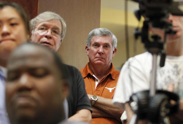 AUSTIN, TX - JUNE 15:  University of Texas at Austin football head coach Mack Brown listens as university officials announce the athletics programs will continue competing in the Big 12 Conference June 15, 2010 in Austin, Texas.  (Photo by Erich Schlegel/