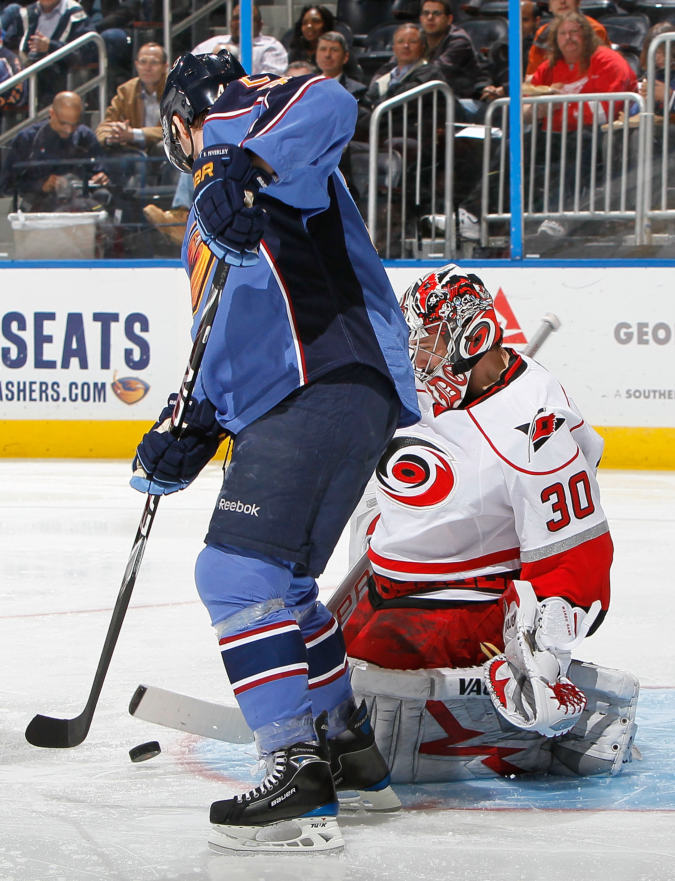 ATLANTA - MARCH 29:  Goaltender Cam Ward #30 of the Carolina Hurricanes saves a shot on goal by Rich Peverley #47 of the Atlanta Thrashers at Philips Arena on March 29, 2010 in Atlanta, Georgia.  (Photo by Kevin C. Cox/Getty Images)