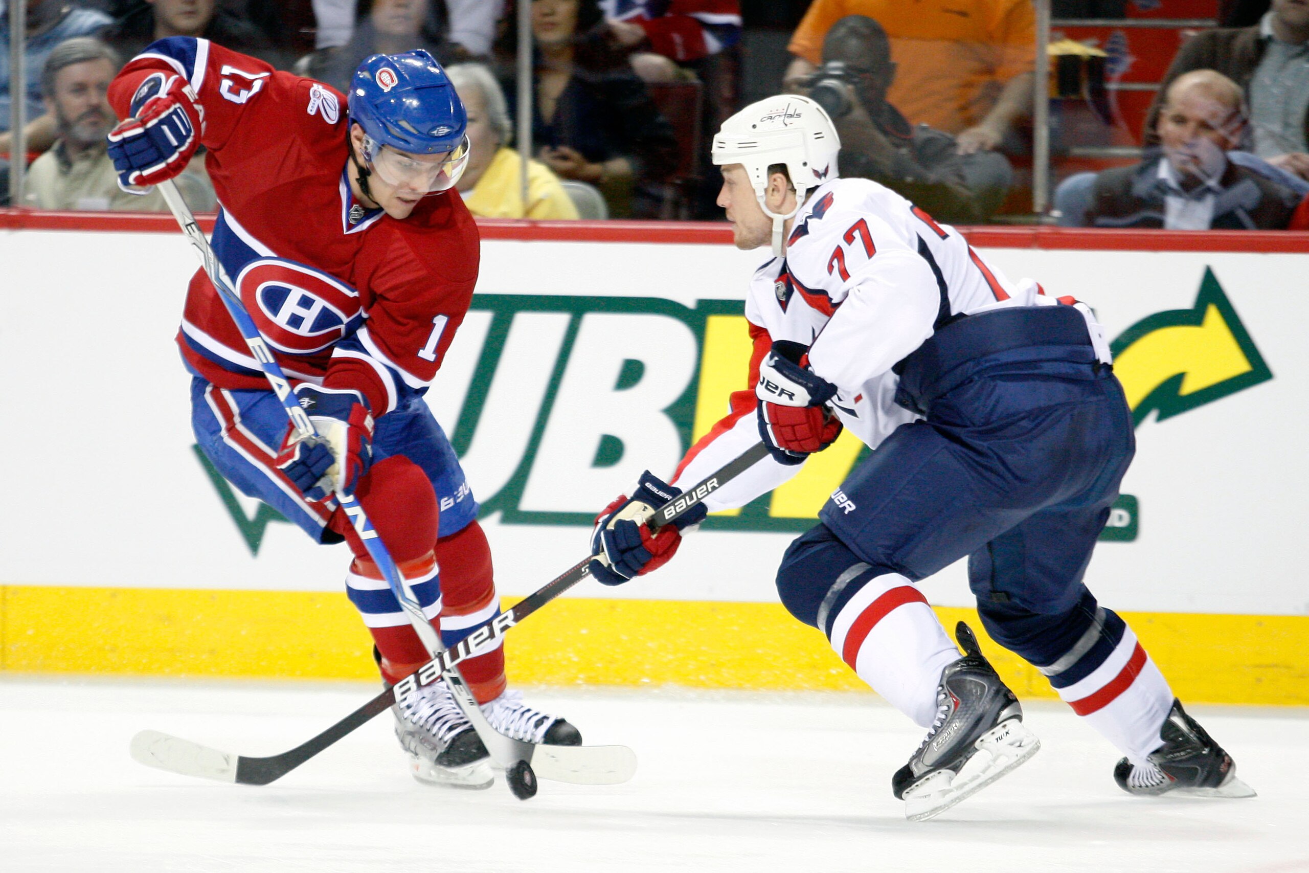 MONTREAL- APRIL 21:  Mike Cammalleri #13 of the Montreal Canadiens while being defended by Joe Corvo #77 of the Washington Capitals in Game Four of the Eastern Conference Quarterfinals during the 2010 NHL Stanley Cup Playoffs at the Bell Centre on April 2