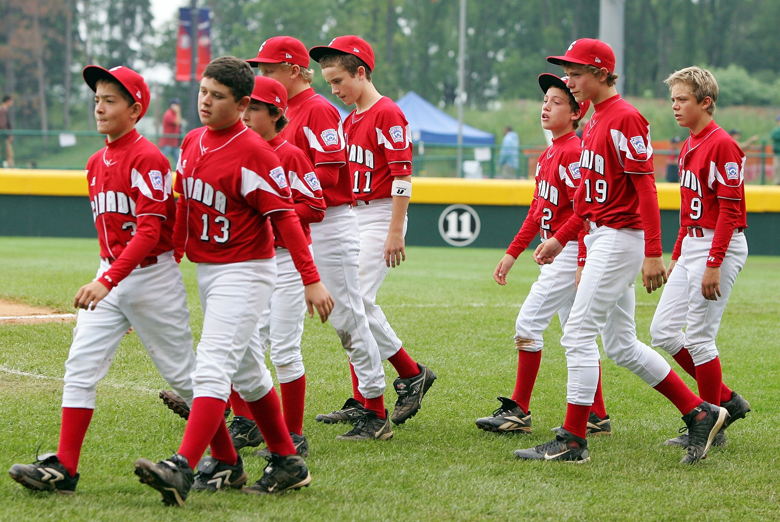 SOUTH WILLIAMSPORT, PA - AUGUST 22: Members of the Canadian team from White Rock, British Columbia walk on the field after losing to the Caribbean team from Willemstad, Curacao during their tournament game in the Little League World Series on August 22, 2 SOUTH WILLIAMSPORT, PA - AUGUST 22: Members of the Canadian team from White Rock, British Columbia walk on the field after losing to the Caribbean team from Willemstad, Curacao during their tournament game in the Little League World Series on August 22, 2